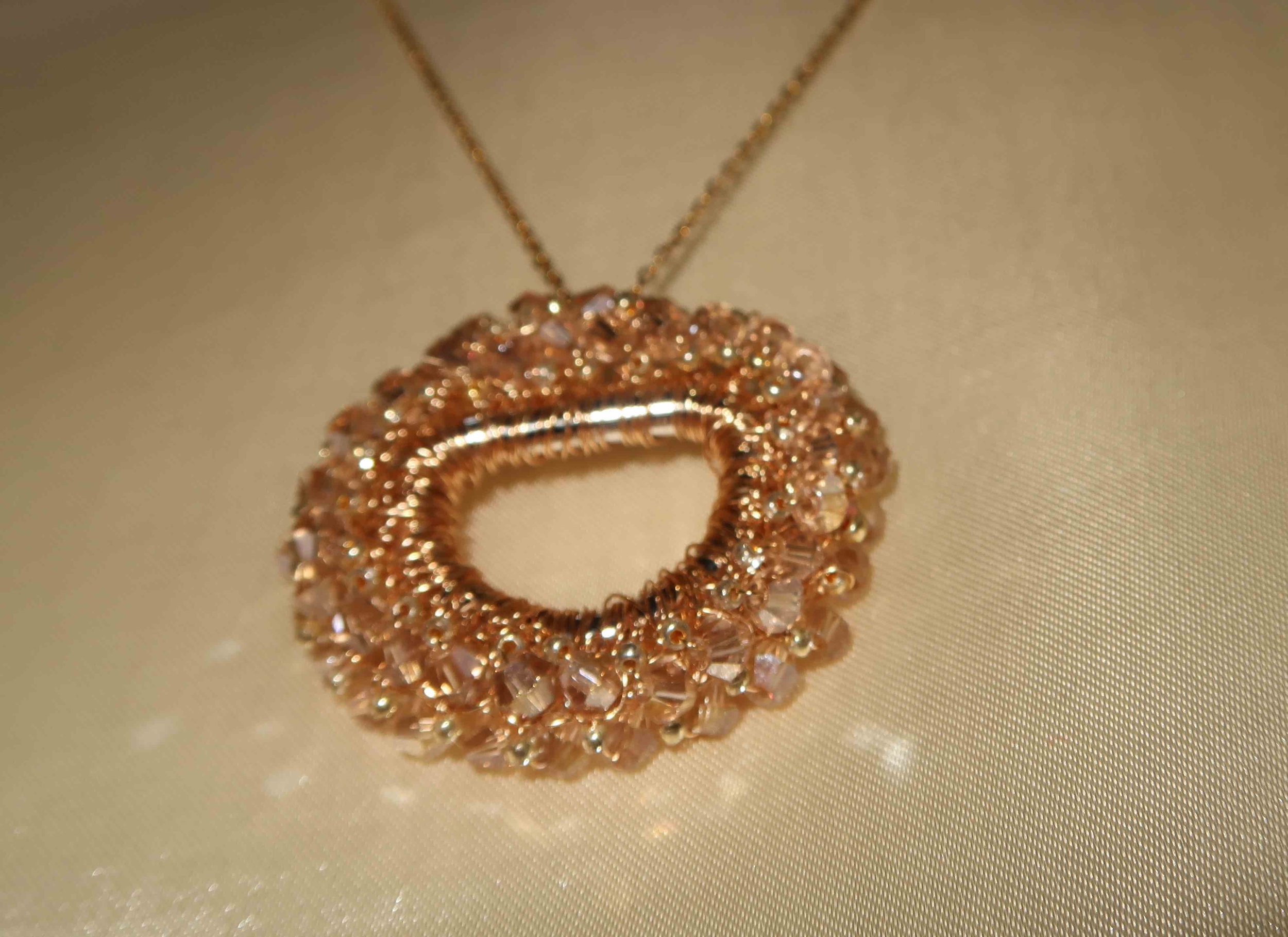 Pendants | hand-crocheted from fine metal wire with crystal detail for elegant sparkle. 