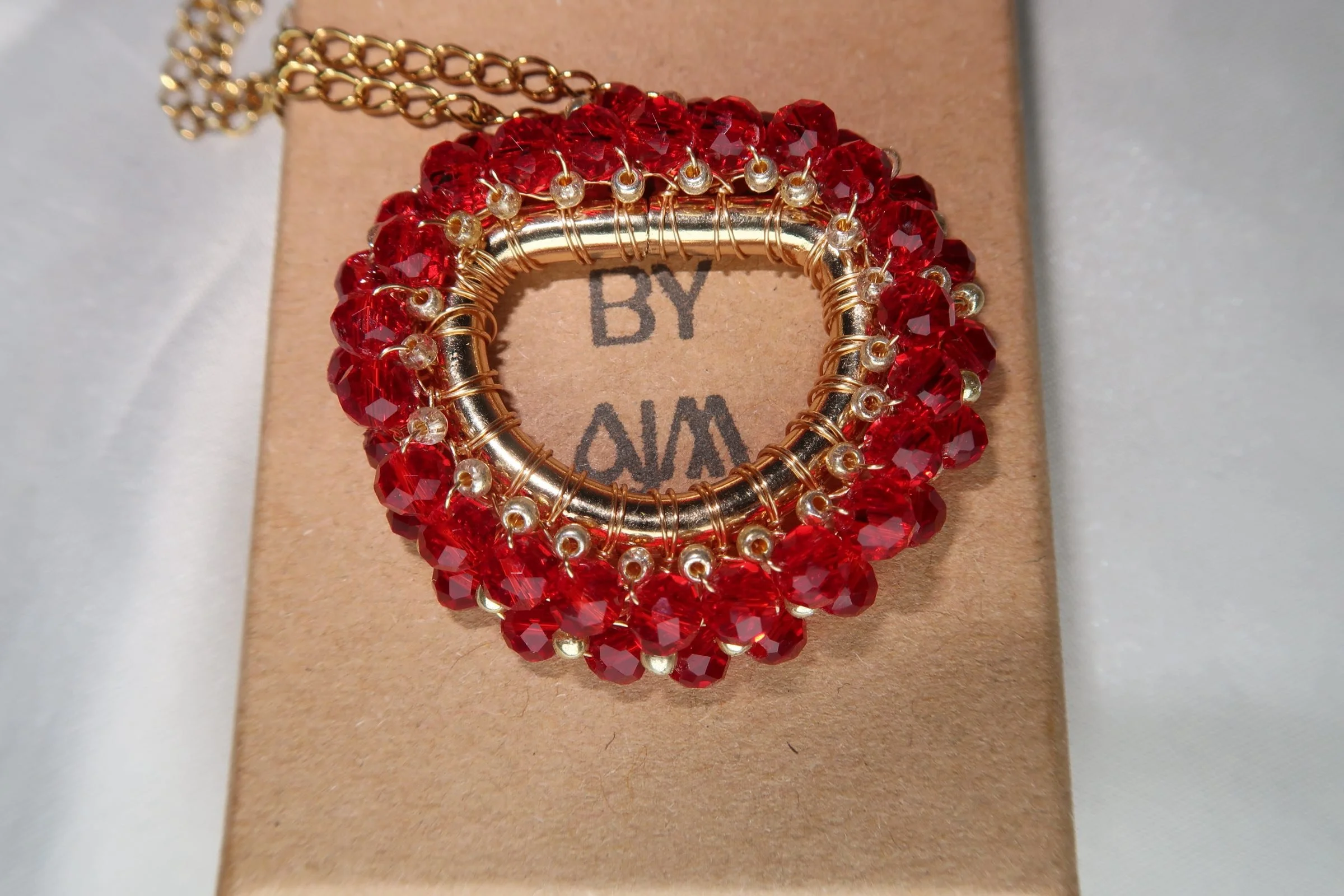 Amira-pendant-red-on-box-close-up.jpeg