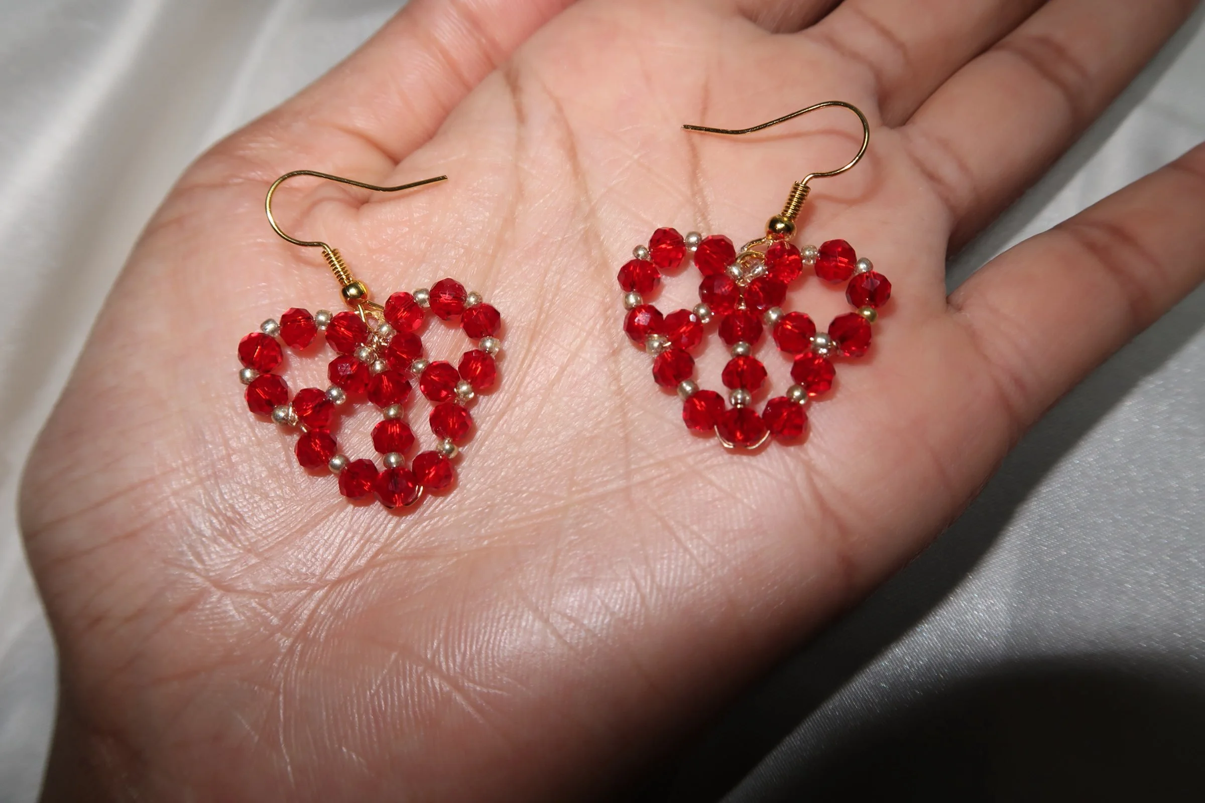 Amira-earrings-on-hands.jpeg