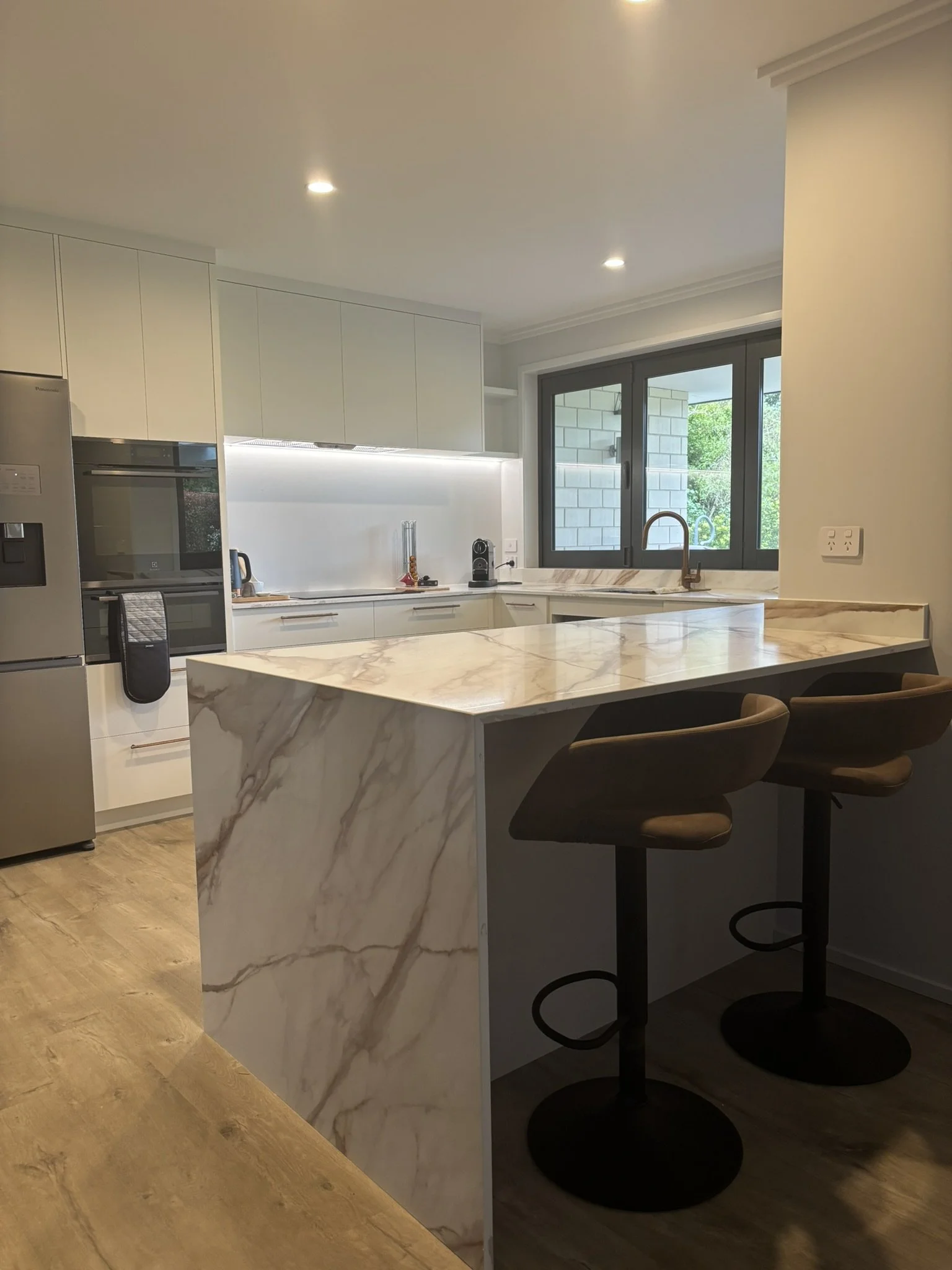 Stone benchtop waterfall island – Northland