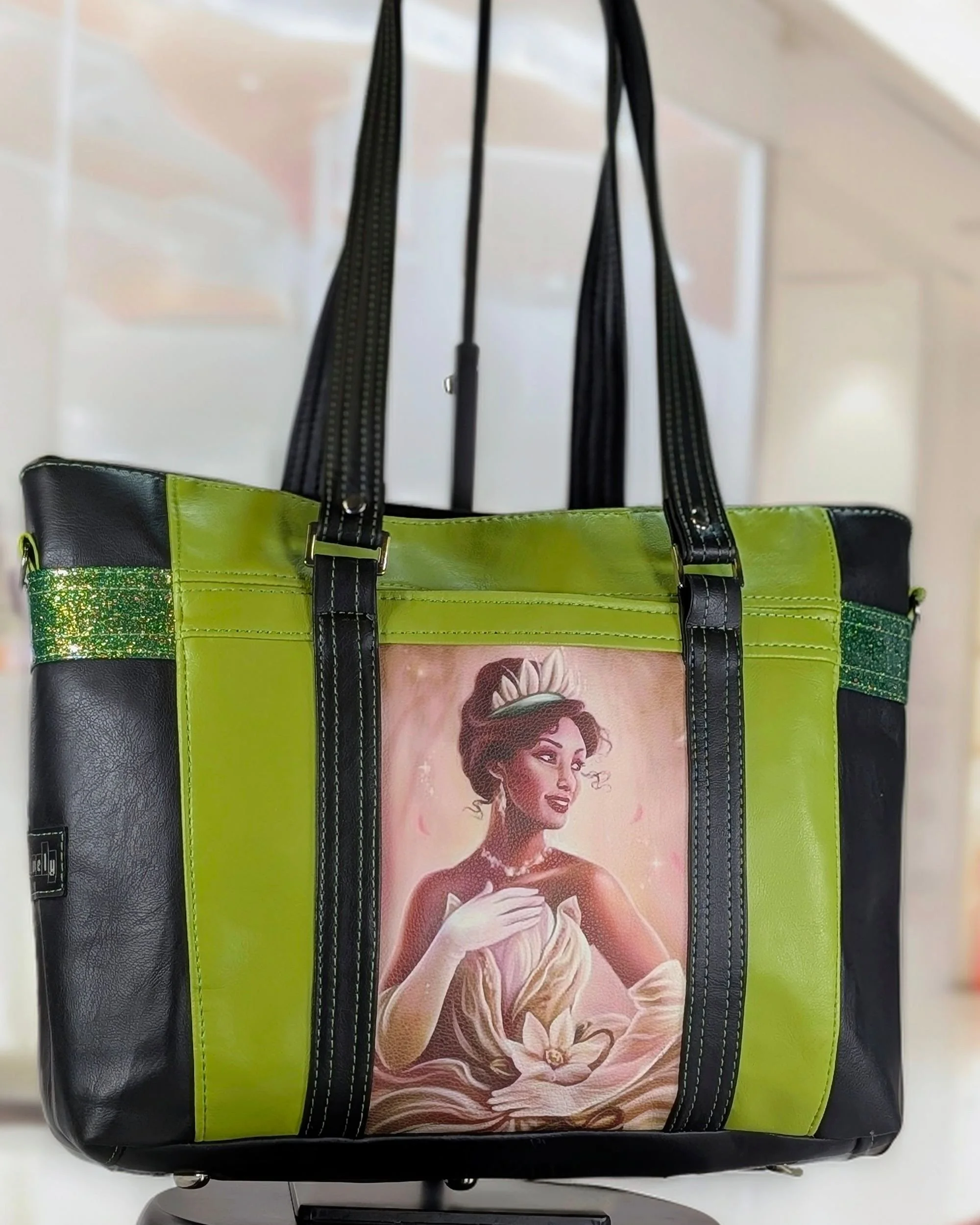 Handmade "Hearsay" tote bag with green and black vinyl and custom Tiana artwork featured on the front, crafted by Creatively Speaking Designs.