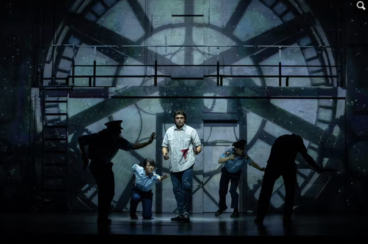 A stage is set like the inside of a giant clock. Phluxus2 performers in Trent Daltons Boy Swallows Universe.