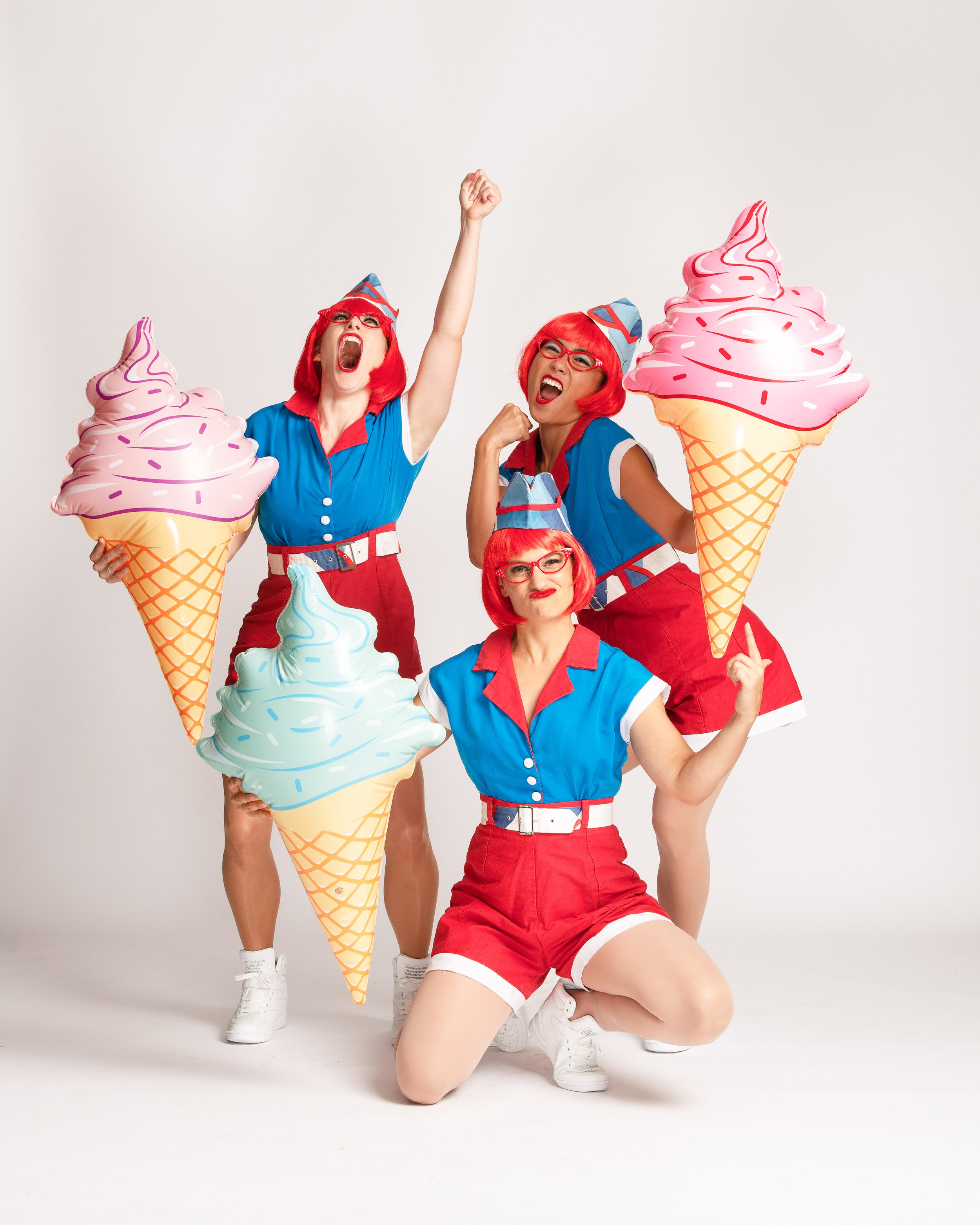 Three bright ice cream ladies dance, shout, smile and pose. Phluxus2 roving entertainment.