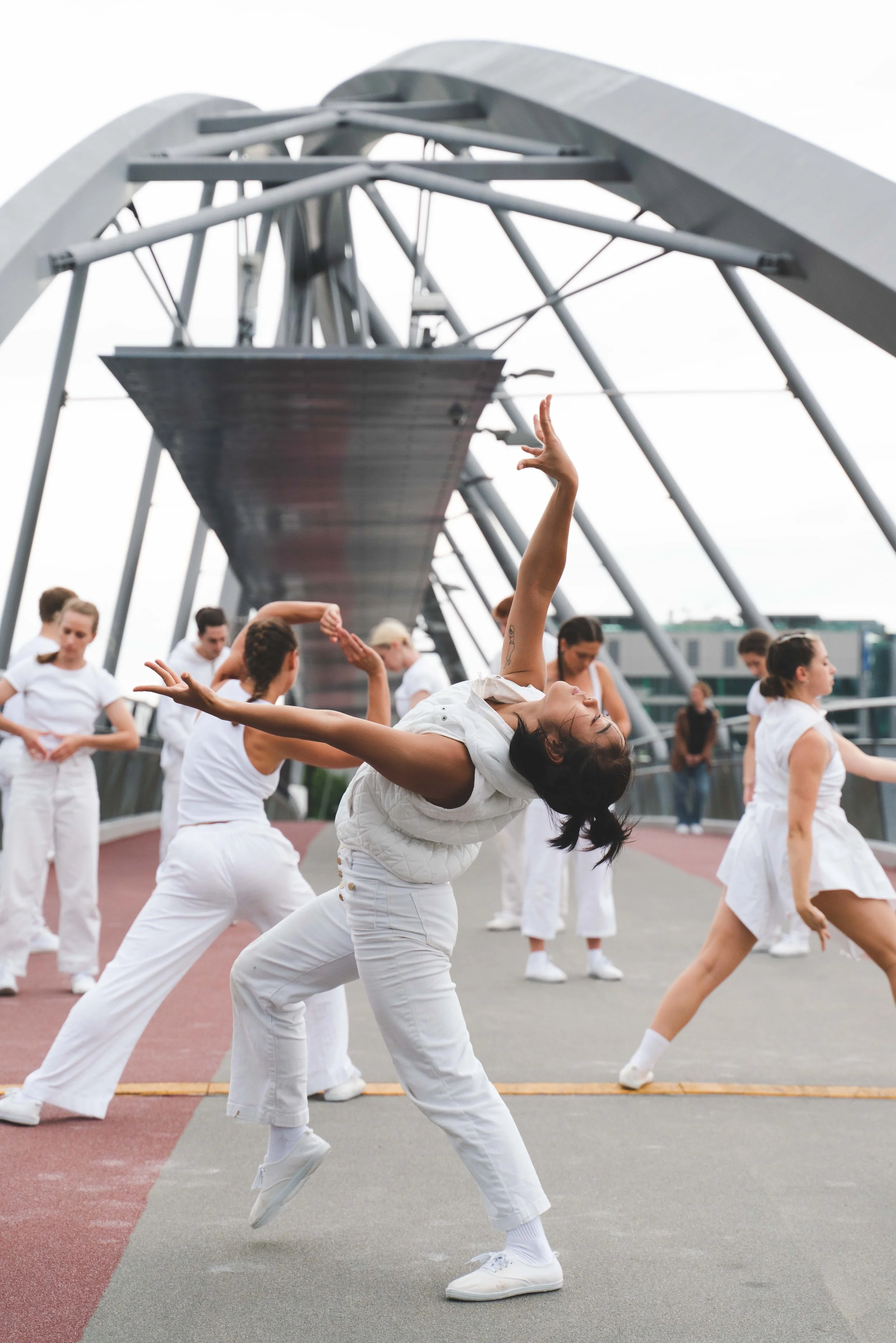 Dancer performs on a bridge in award winning dance film by Nerida Matthaei and Phluxus2 Dance Collective