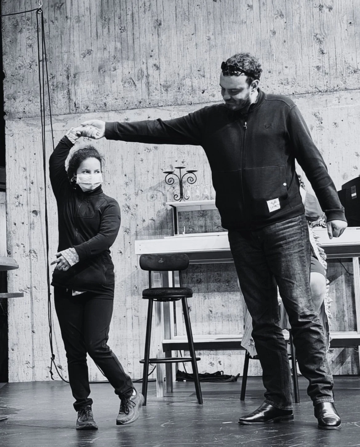 Nicholas and Azarah are rehearsing in the Hannah Playhouse. Nicholas is twirling Azarah around as if they are dancing.