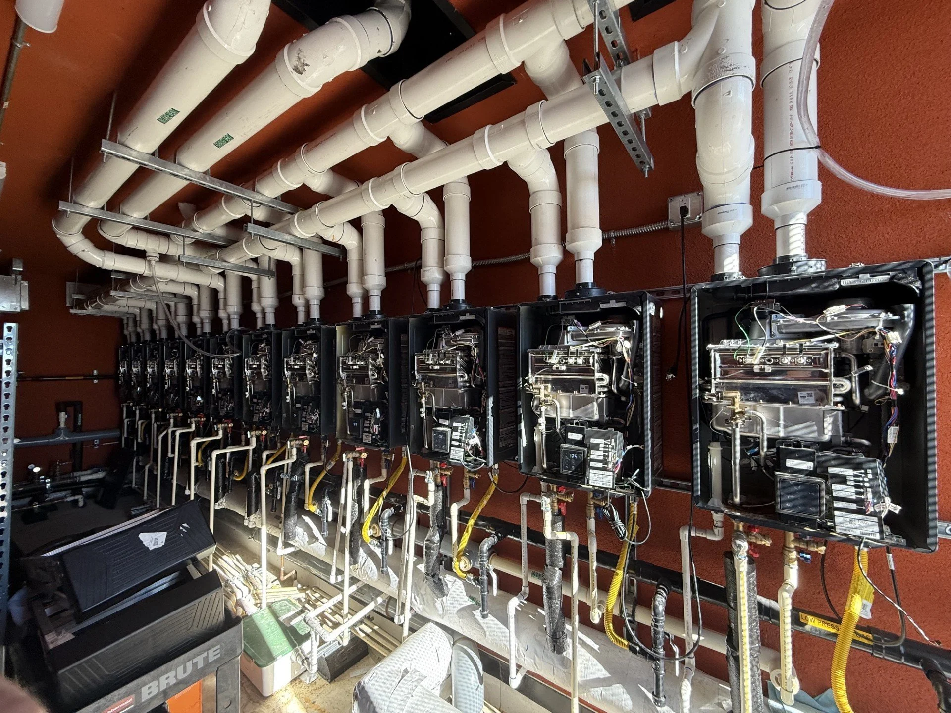 mechanical room with cascades navien tankless water heaters