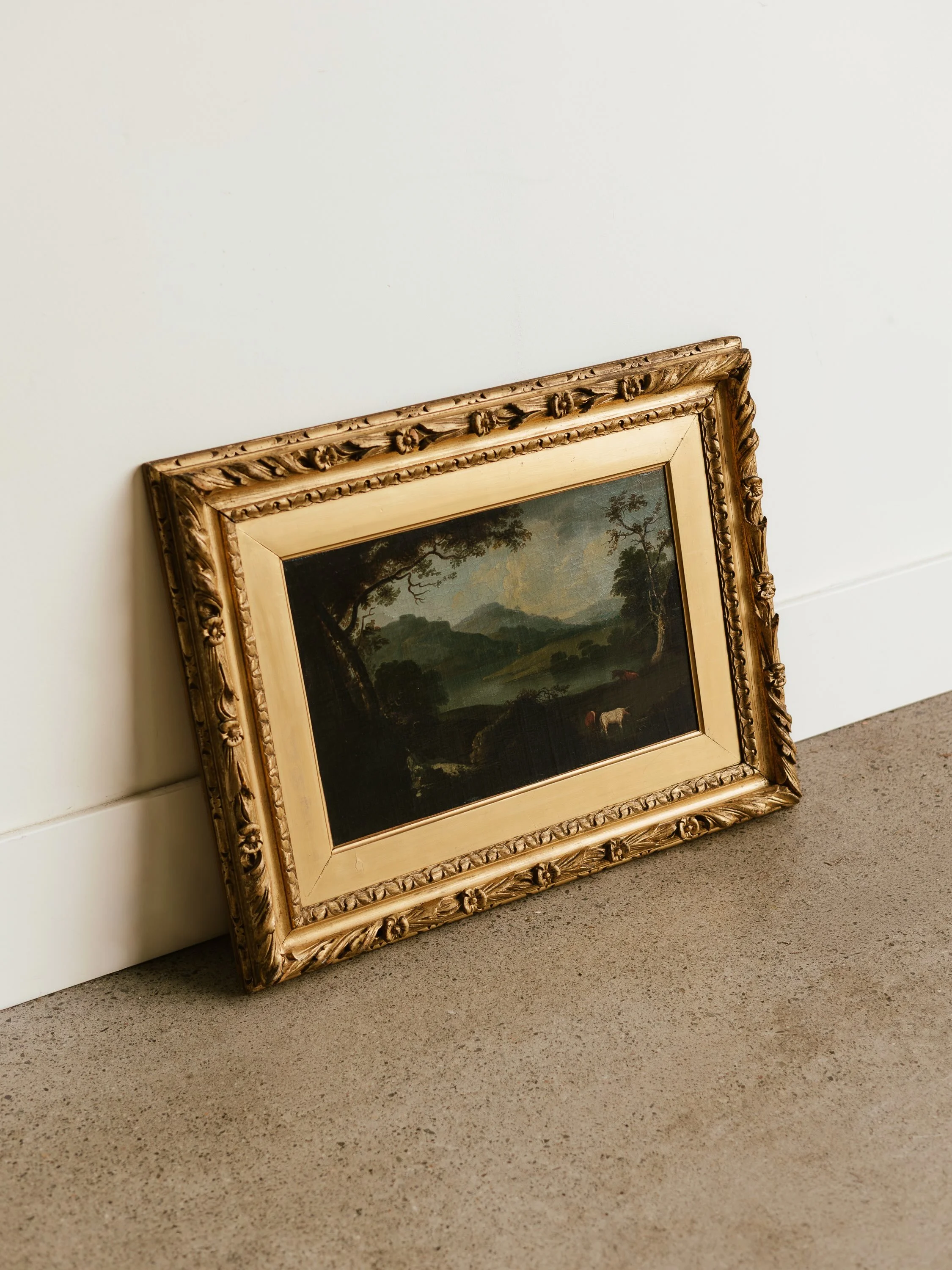 meet our &ldquo;landscape with watering cow&rdquo; oil painting. 

richly coloured antique oil on canvas from the 19th century european school, featuring a peaceful countryside scene with a cow at the water&rsquo;s edge. unsigned, yet full of timeles
