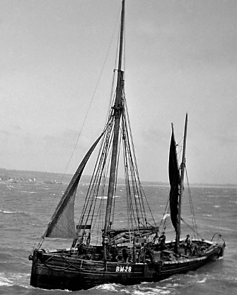 A black and white photo of Provident with multiple masts on the water.