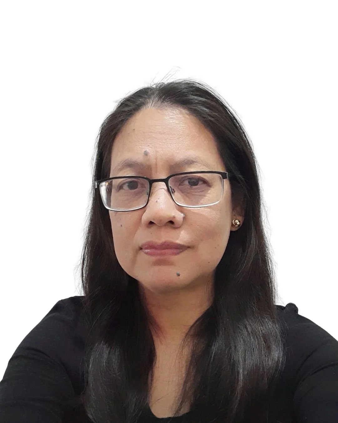 A close-up selfie of a woman with long dark hair, glasses, earrings, and a black top, against a plain white background.