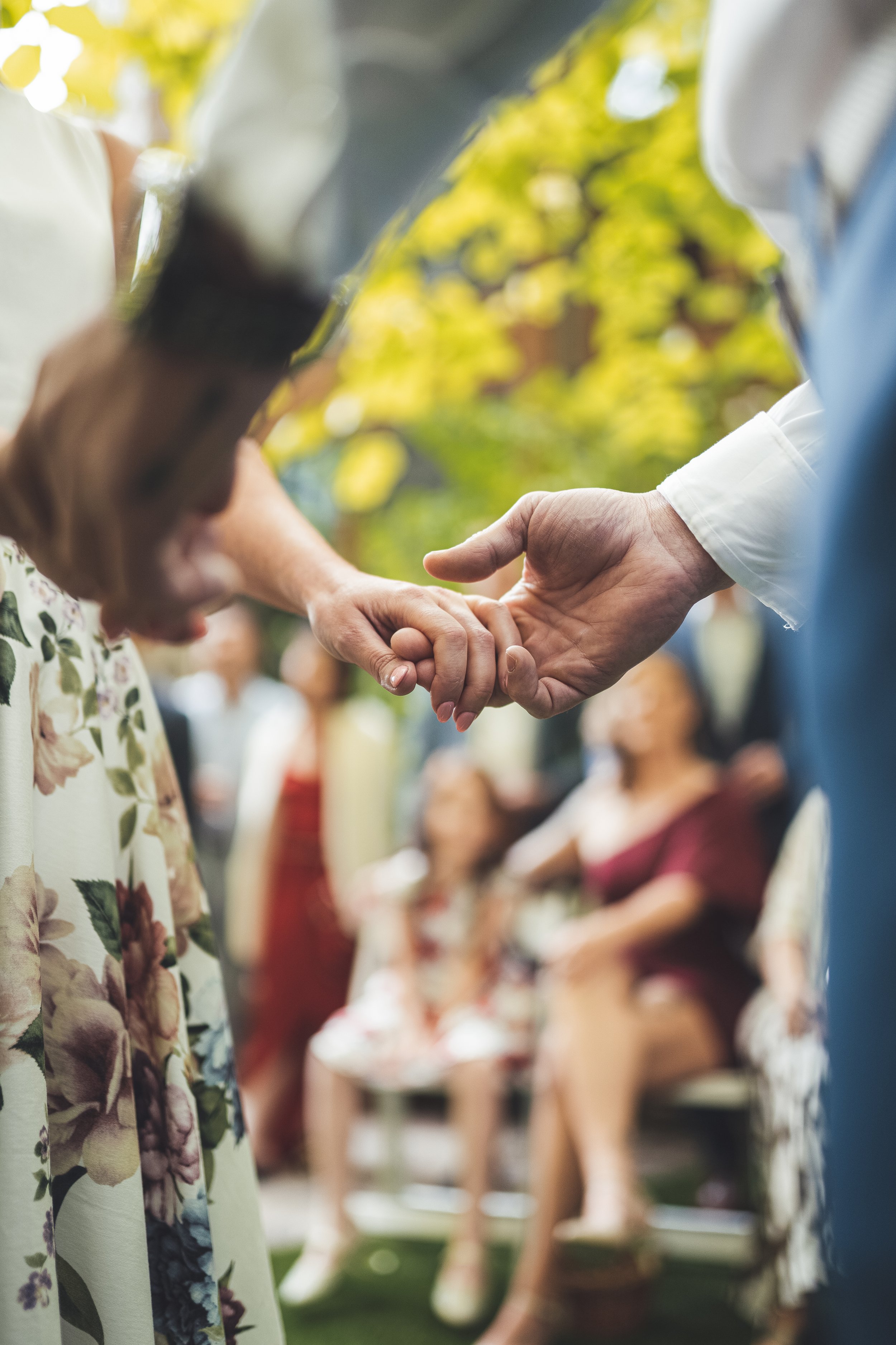 between-light-photography-wedding-holding-hands-closeup.jpeg