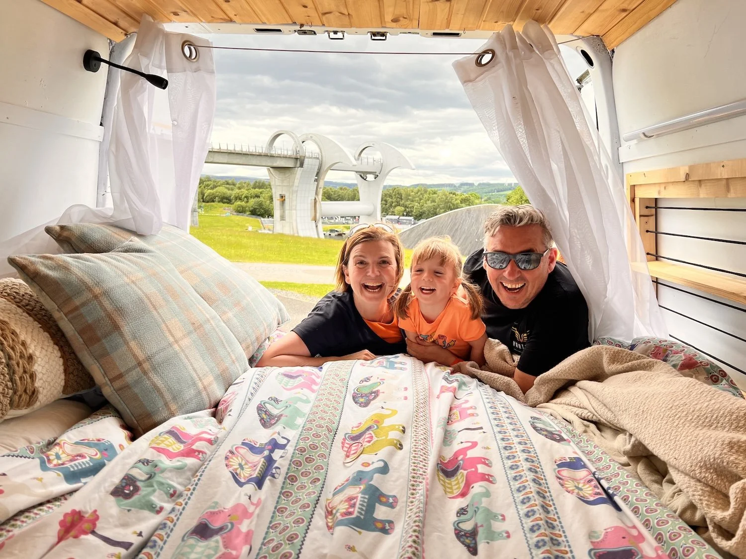Paul and Shona Morgan as a family in their older campervan - TXM Campers