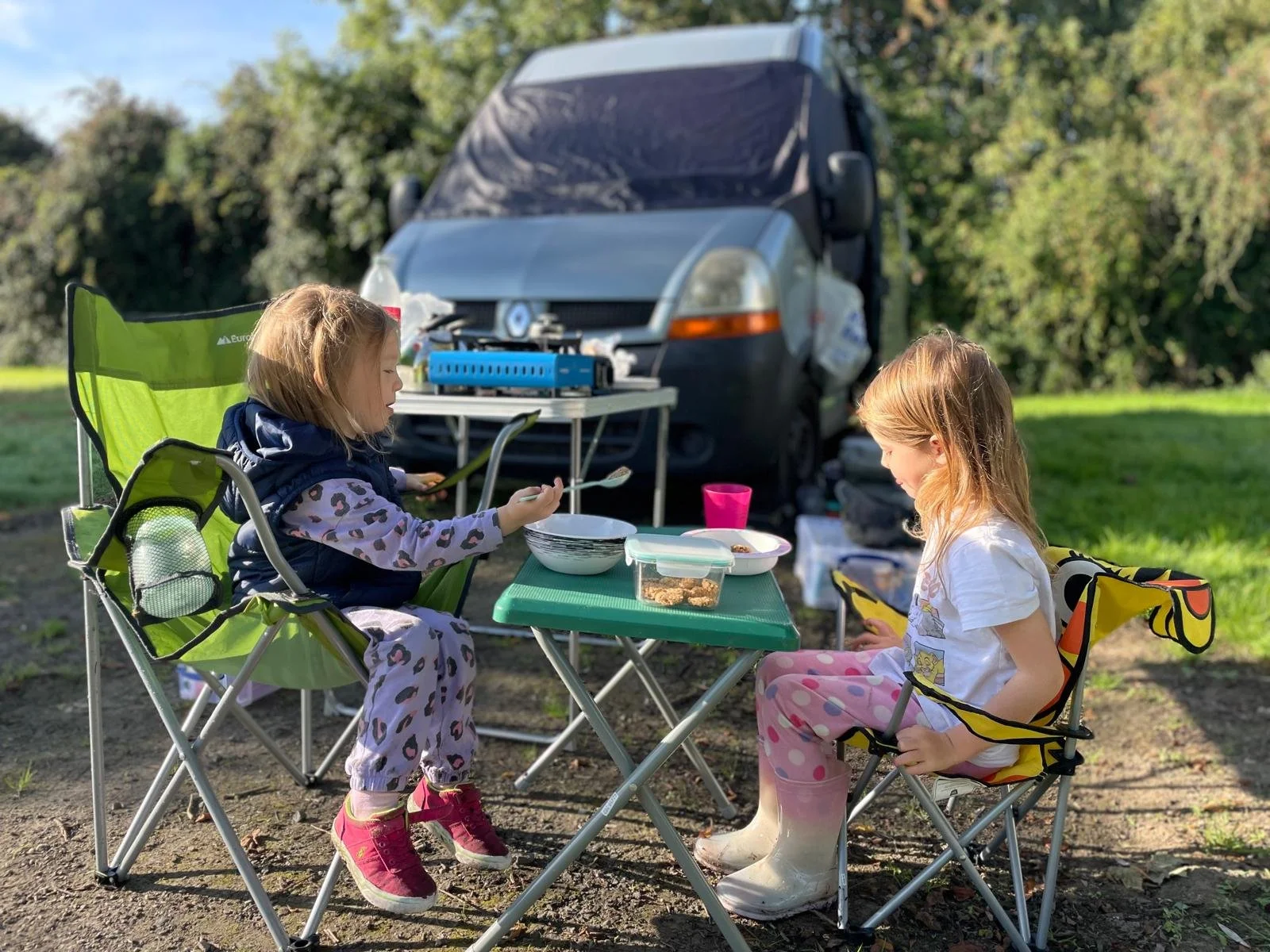 Campervan hire Scotland with young children on family picnic showing VW campervan owned by TXM Campers