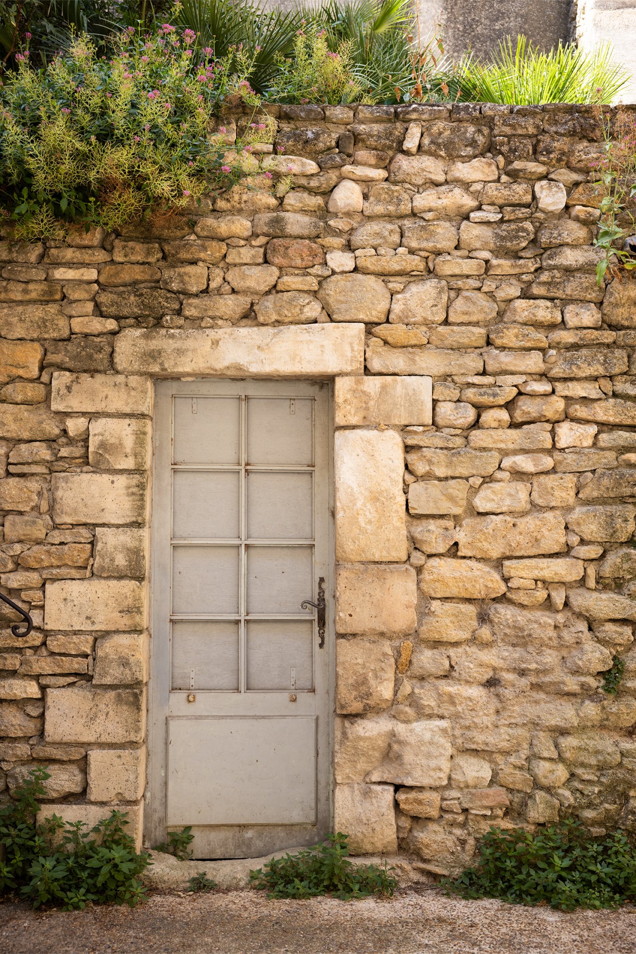 Stone wall on Rue Sainte Estève in Menerbes France