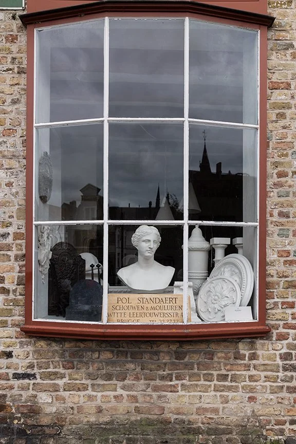 Pol Standaert storefront window in Bruges