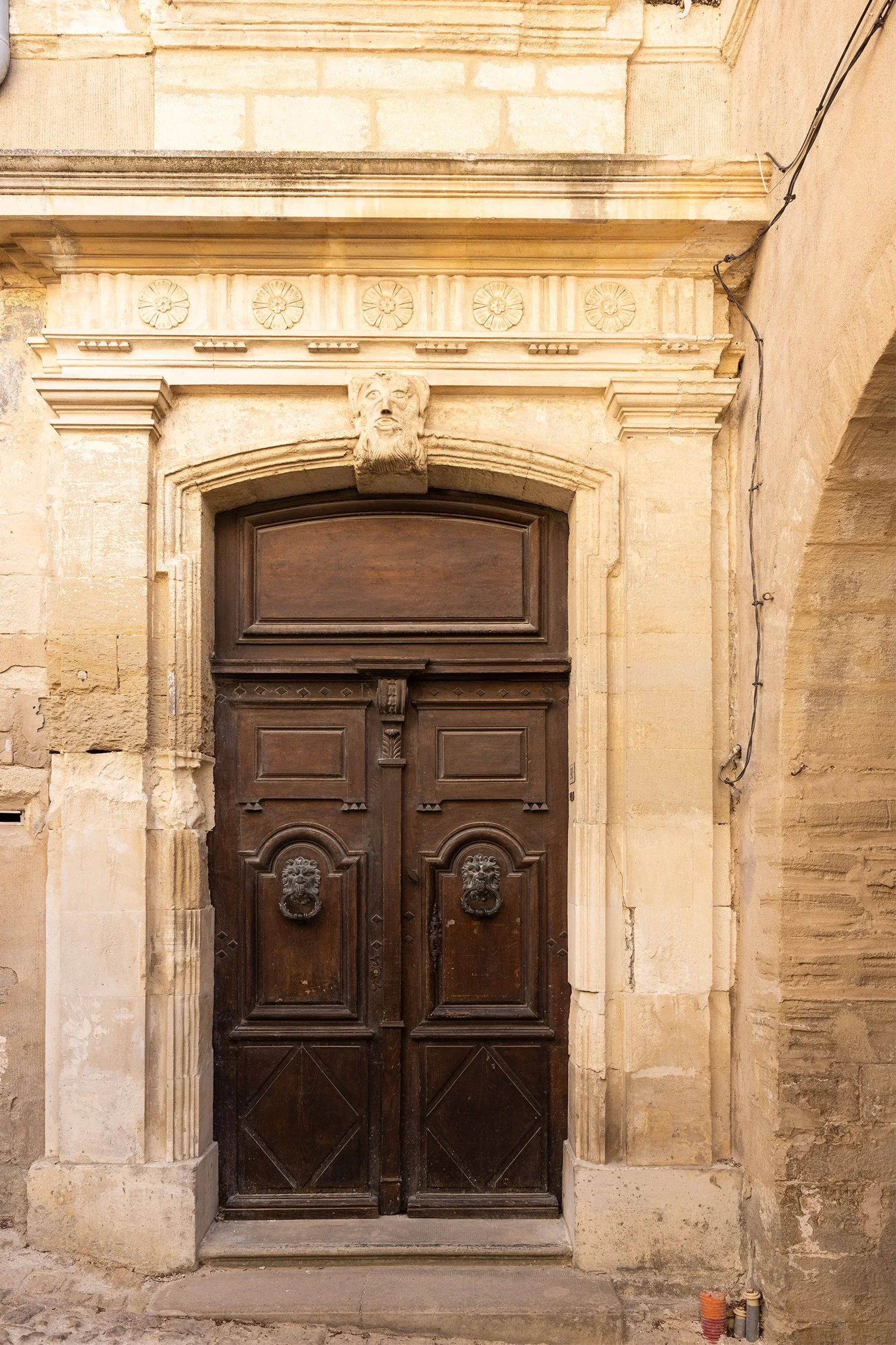 Door of the townhouse Hôtel de Pluvinel at Place de l'Eglise in Gordes, France