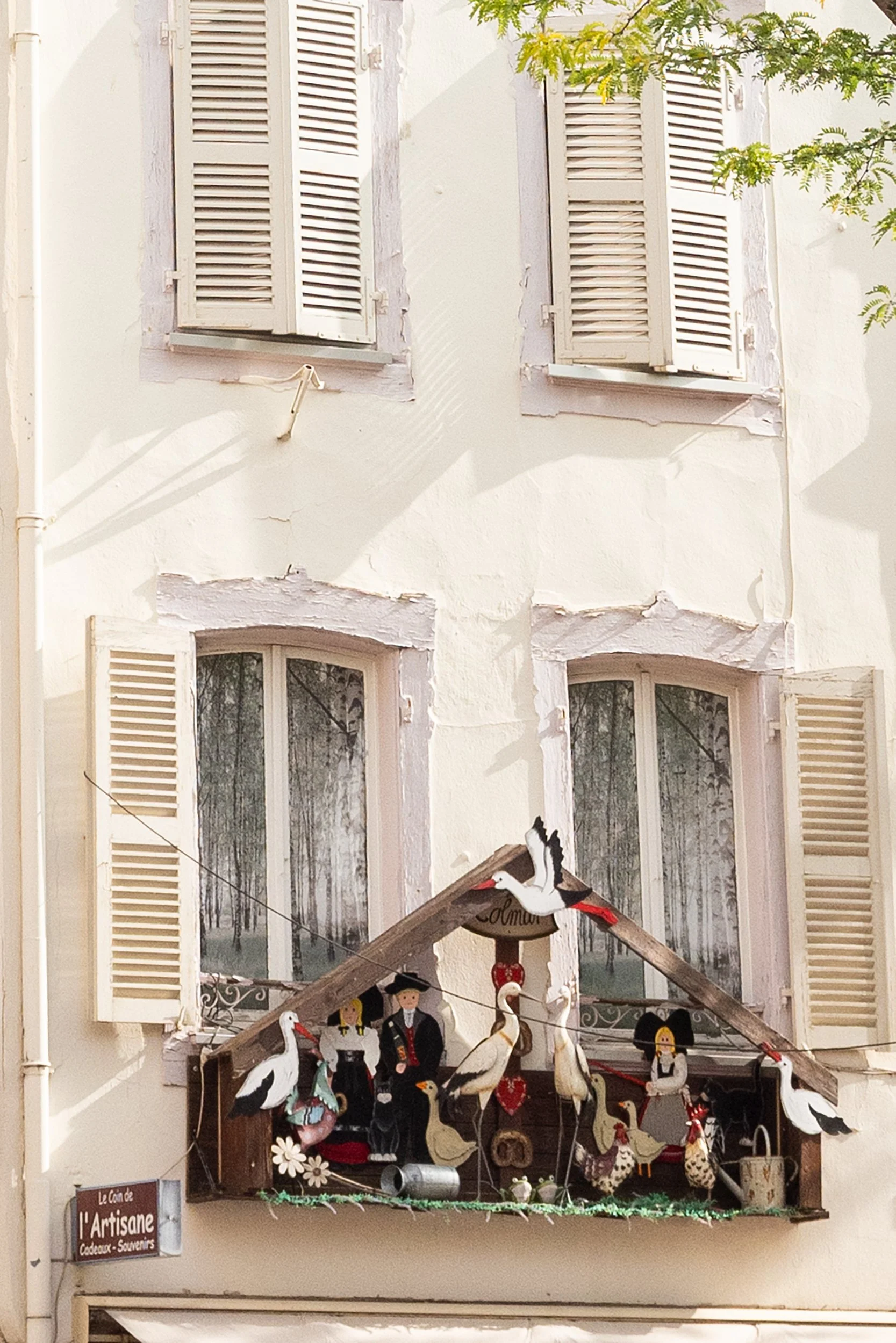 A menagerie with storks at Le coin de l'artisane on Rue Saint Nicolas, Colmar