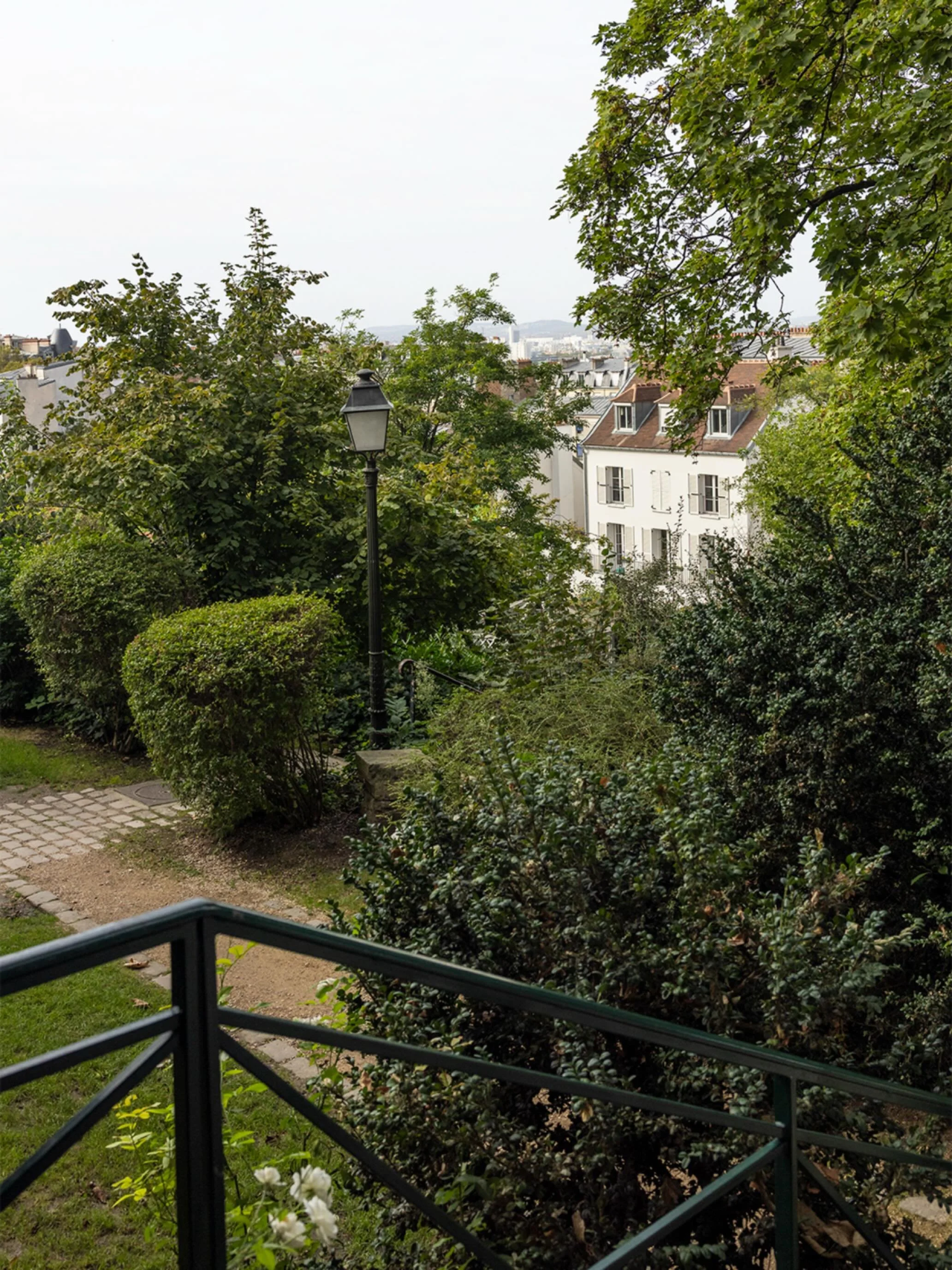 Renoir Gardens at the Mus&eacute;e de Montmartre in Paris. Earlier in the day, I met an artist selling beautiful paintings who pointed me toward her painting spot. If you&rsquo;ve never been, it&rsquo;s a hidden oasis tucked away in the bustle of tou