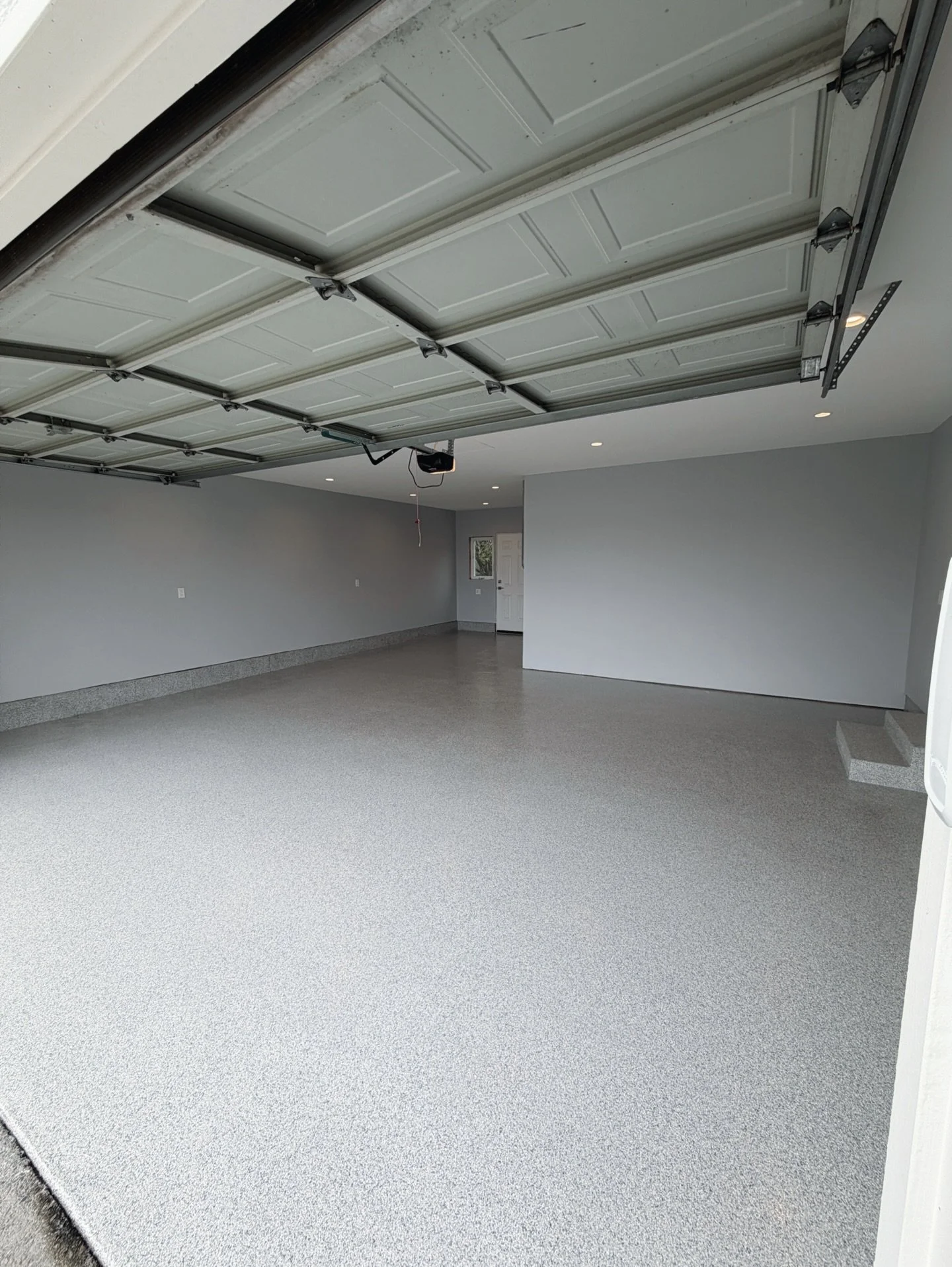 We transformed this garage with our Tidal Wave chip blend in a 1/8&rdquo; flake size, a custom order requested by the homeowner.
From flake size and color blends to hybrid designs and stenciling, we can customize your garage to fit your style and spa