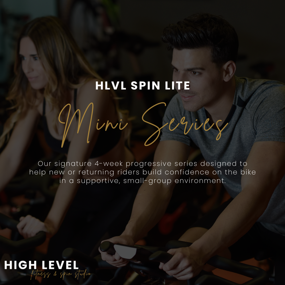 A man and woman working out on stationary bikes indoors, with overlay text promoting HLVL Spin Lite Mini Series at High Level Fitness & Spin Studio.