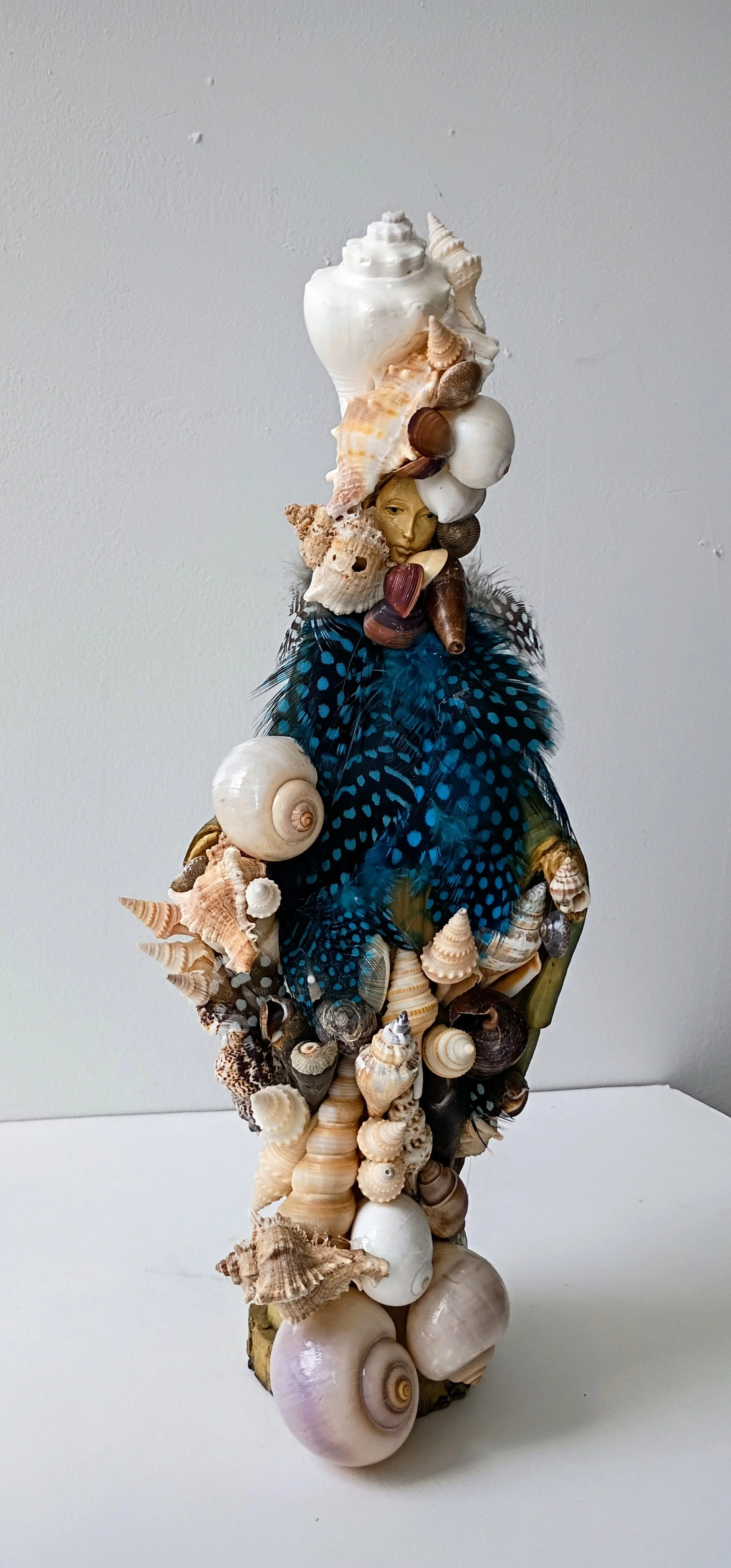Madonna with Shells and Feathers