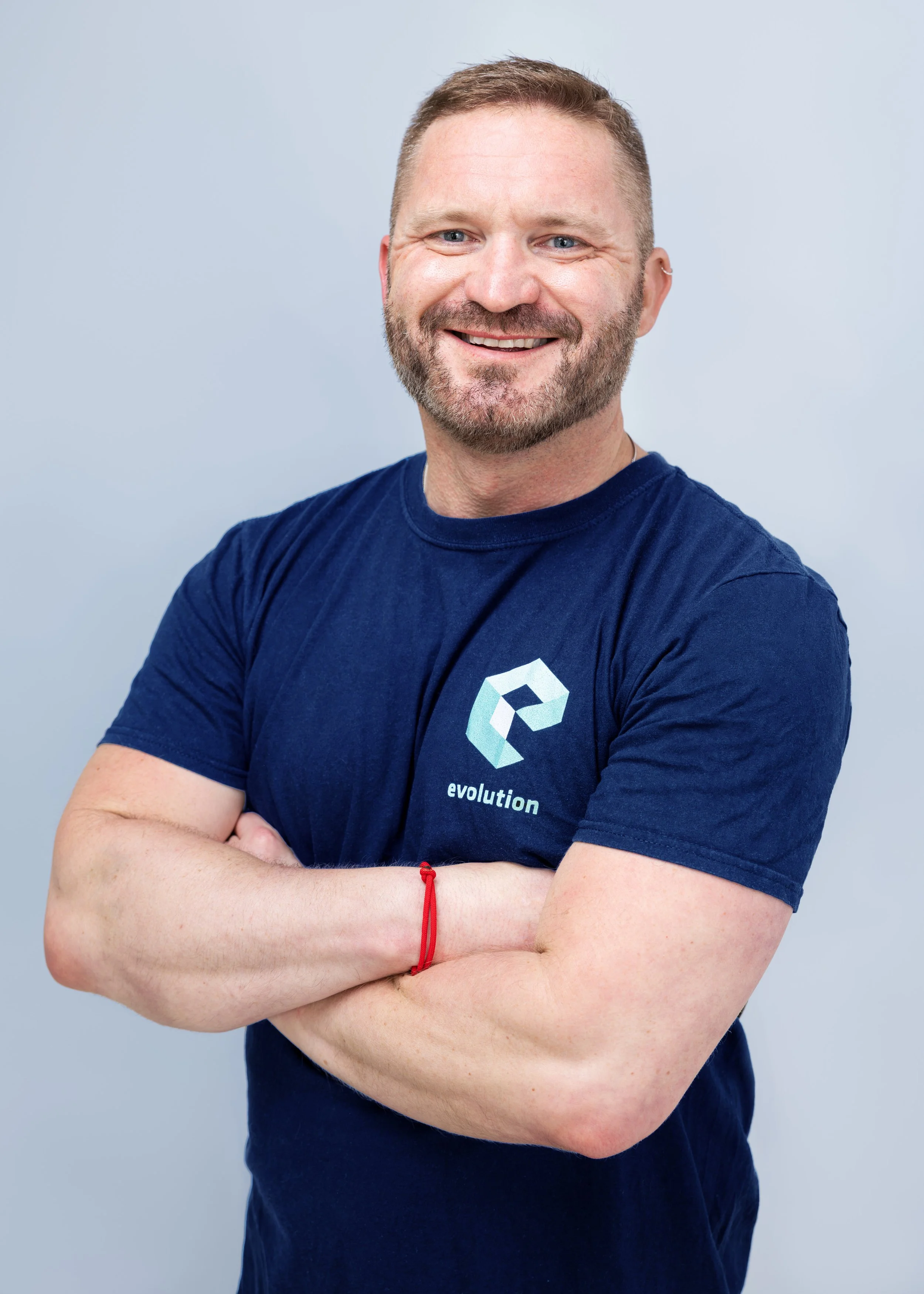 Matthew Wood Director of Evolution Osteopathy a dark blond haired man with a beard and a blue t-shirt