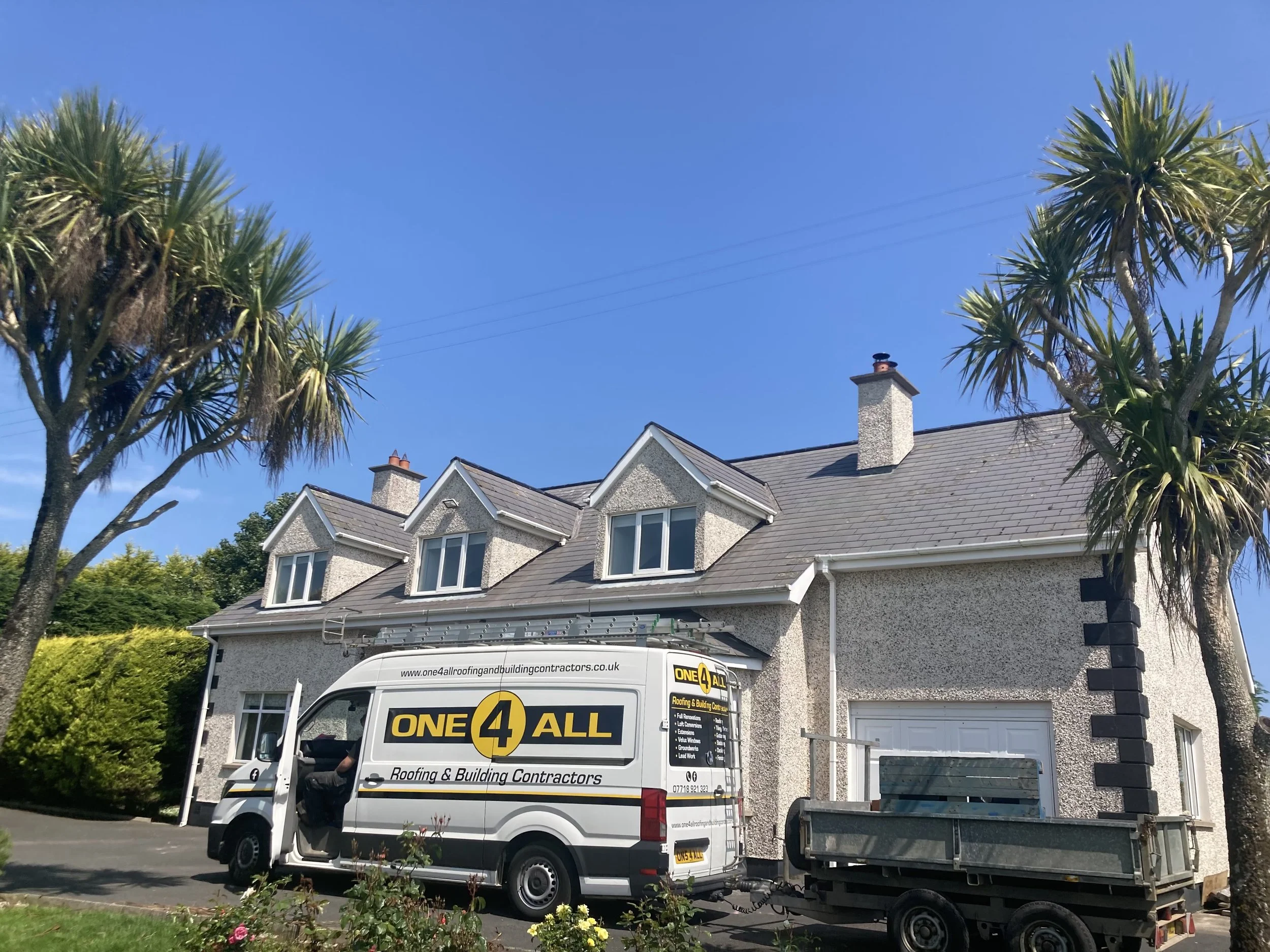 One 4 All Roofing and Building van and trailer parked outside a rendered detached house