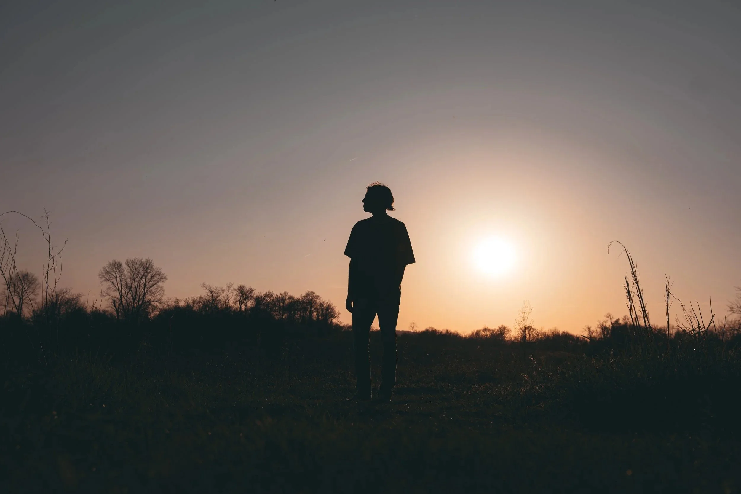 Portrait of a person silhouetted against a sunset in Lancaster, Pennsylvania.