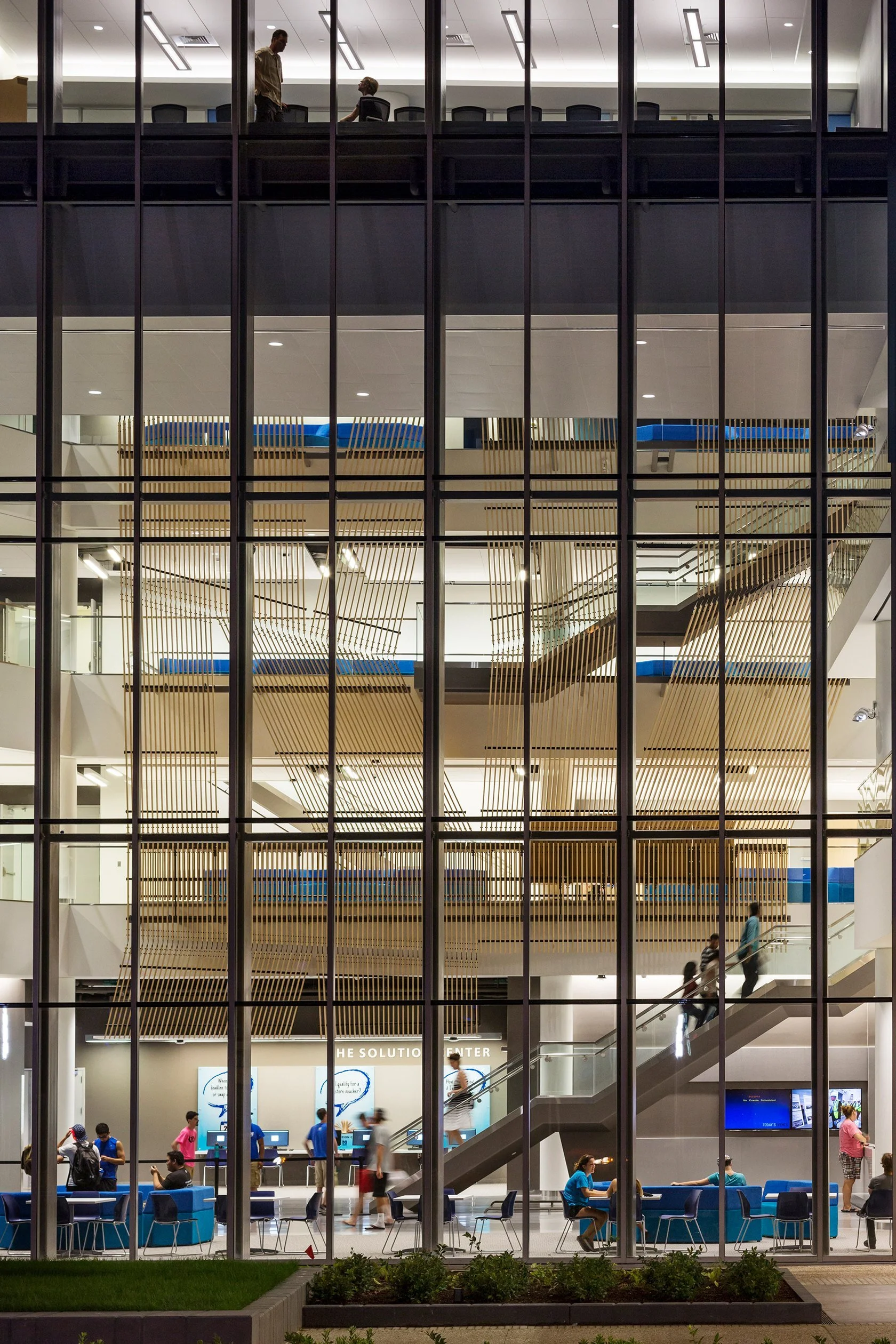 02-university-crossing-a-tall-atrium-with-stairs-and-glass.jpg