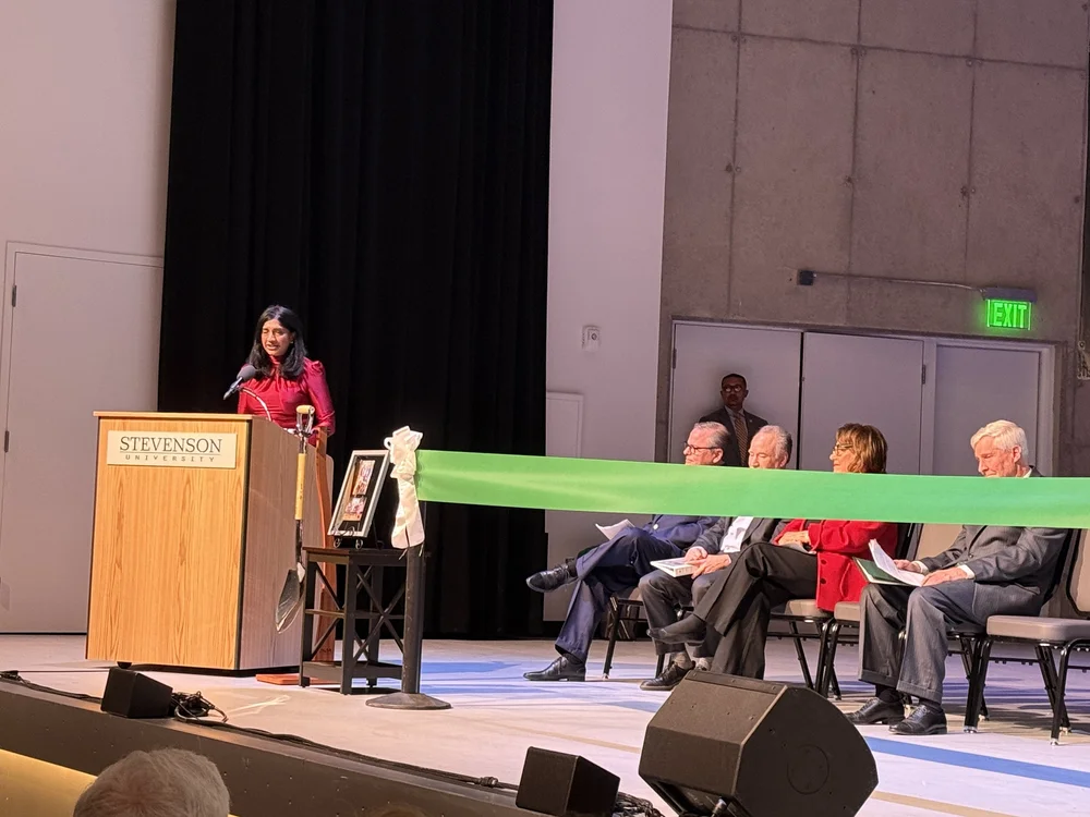 Ribbon cutting on the stage of the Performing Arts Center
