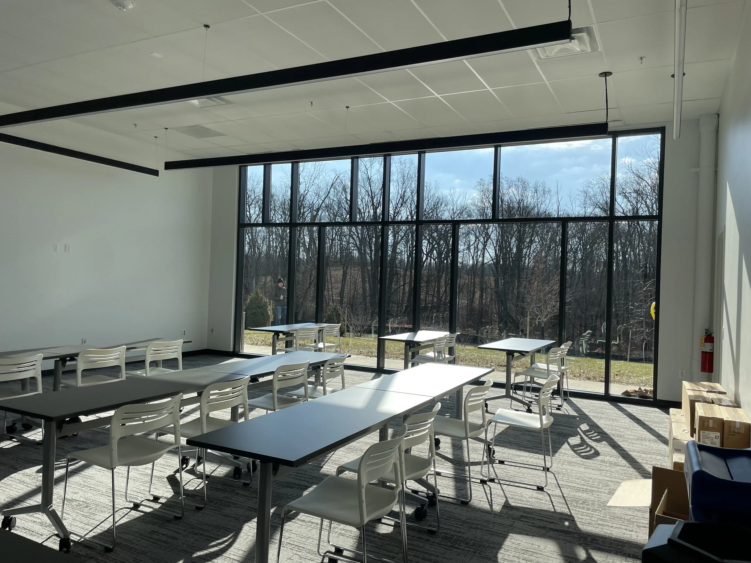 28-zaffere-library-a-classroom-with-long-tables-and-a-window-wall.jpg