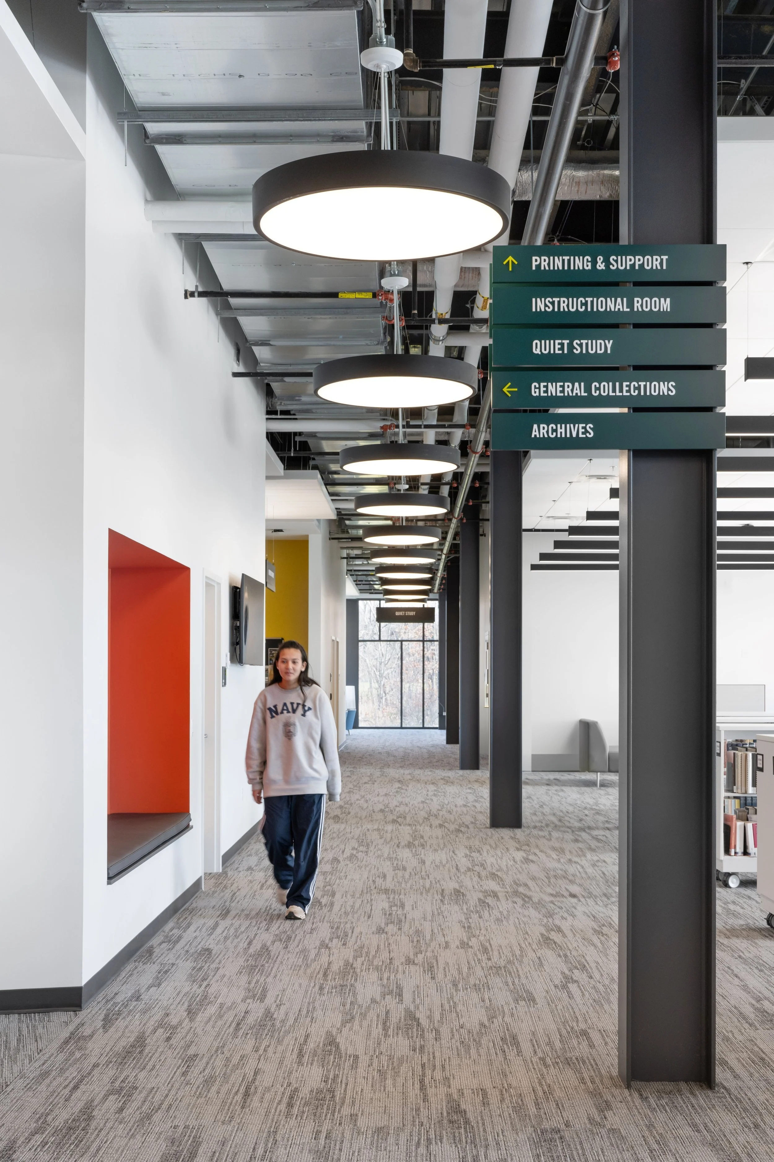 16-zaffere-library-a-corridor-with-an-orange-niche-and-a-wayfinding.jpg