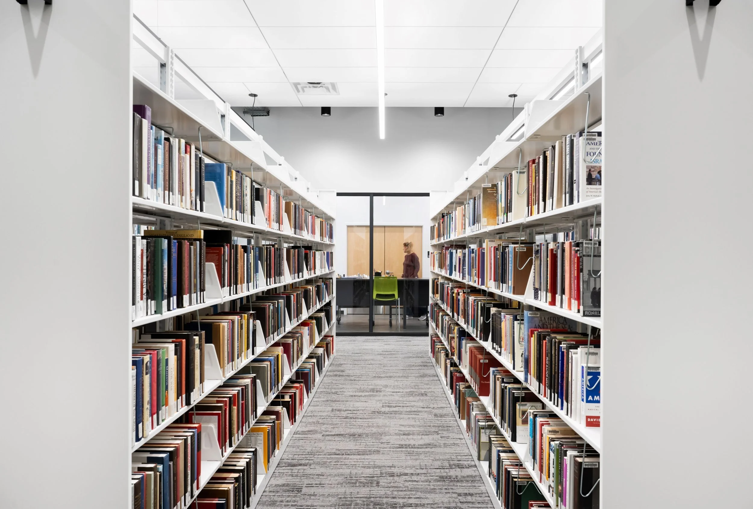 21-zaffere-library-tall-bookshelves-on-both-sides-of-an-aisle.jpg