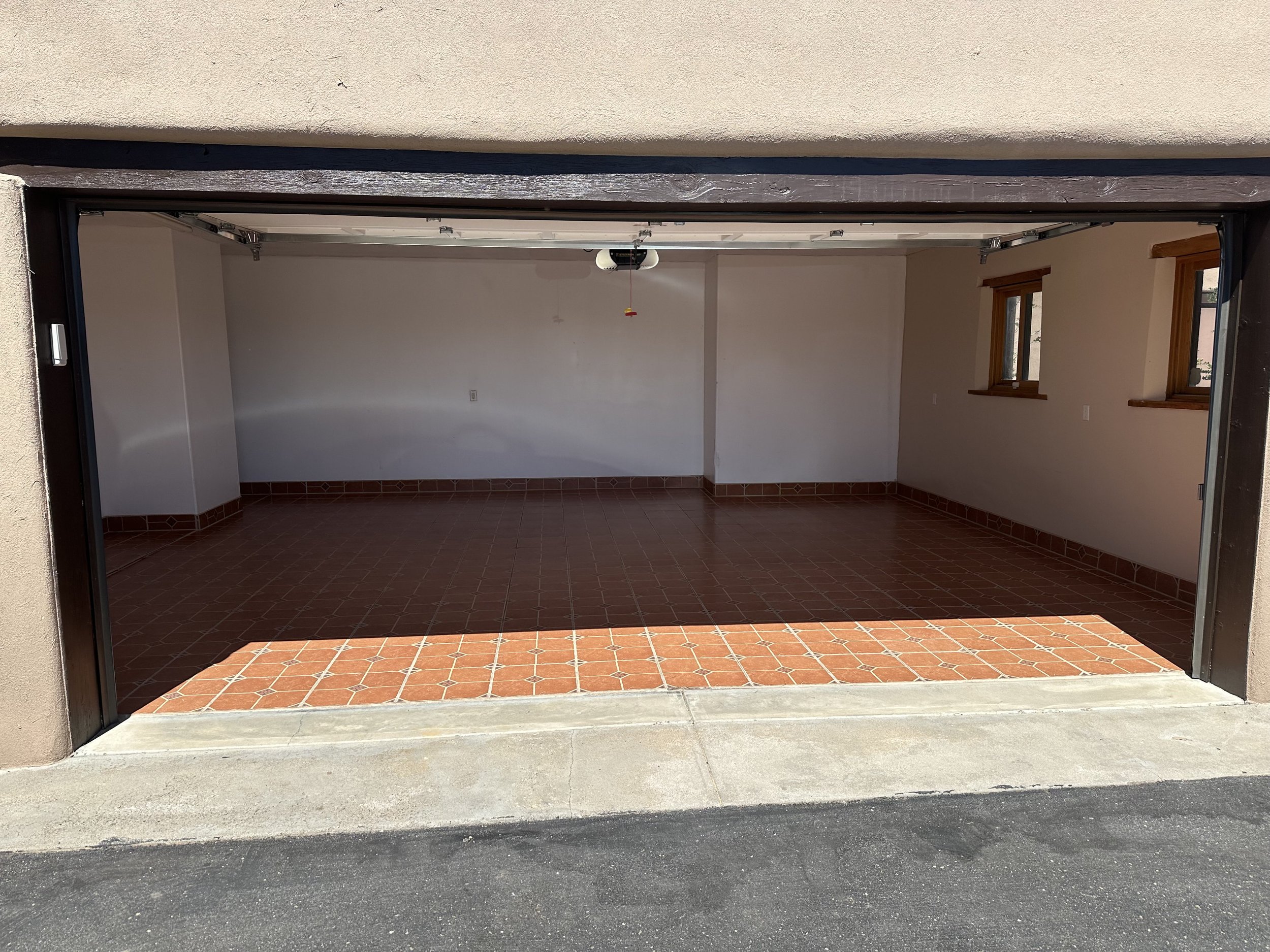 Customer wanted tile in the garage space with a tile base board.