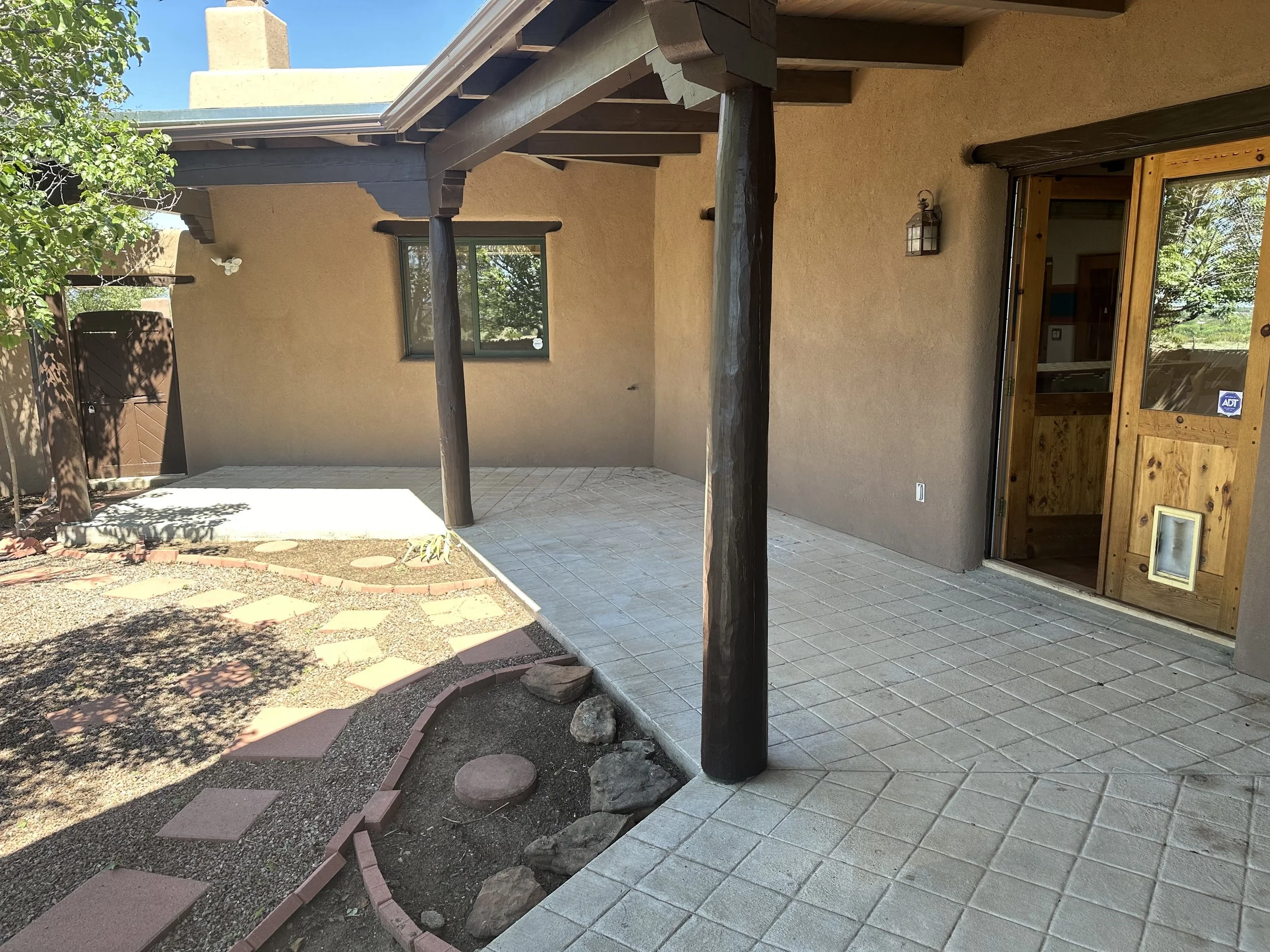 Paint and Stain work in the back courtyard for all the posts and beams as well as window and door headers.