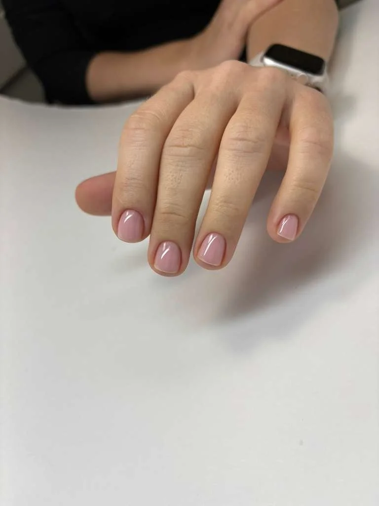 Russian manicure with regular polish focusing on natural nail health, precision, and a clean, lasting result