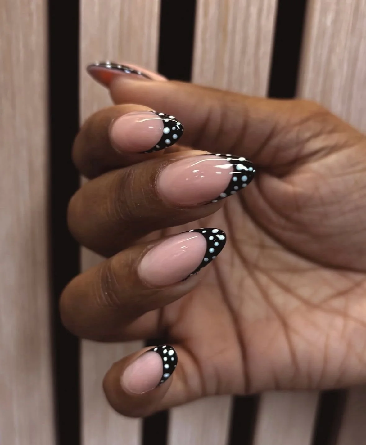 Classic French tip manicure with clean structure and refined cuticle finish.