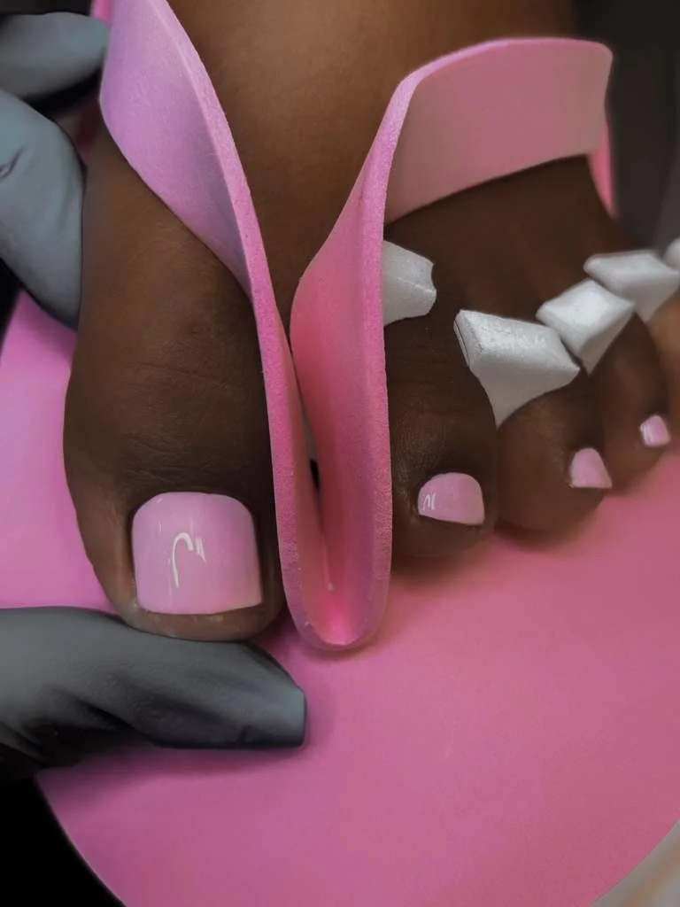 Russian pedicure with regular polish, focusing on clean cuticle work, natural nail structure, and healthy foot care.