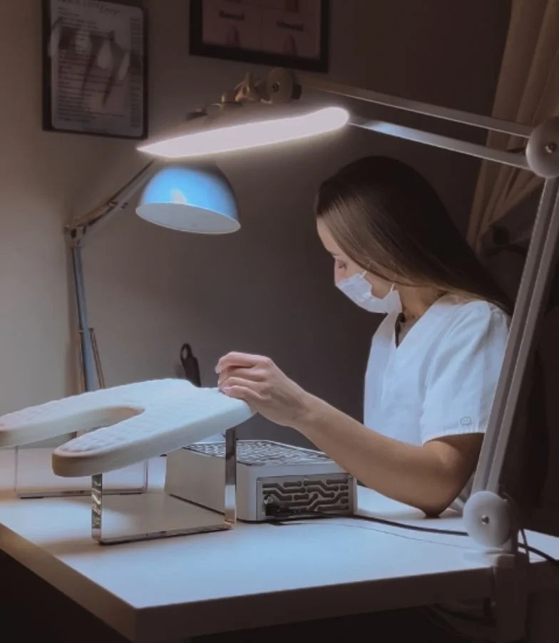 Tatiana performing a Russian manicure using precision e-file technique, focusing on nail health, structure, and anatomy-based care.