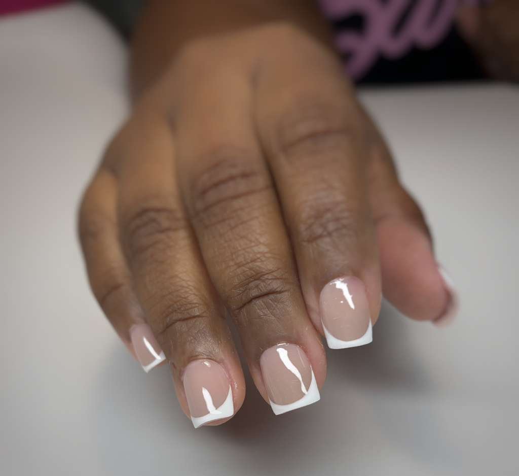 Russian manicure with short extensions designed for natural structure, durability, and detailed cuticle preparation.