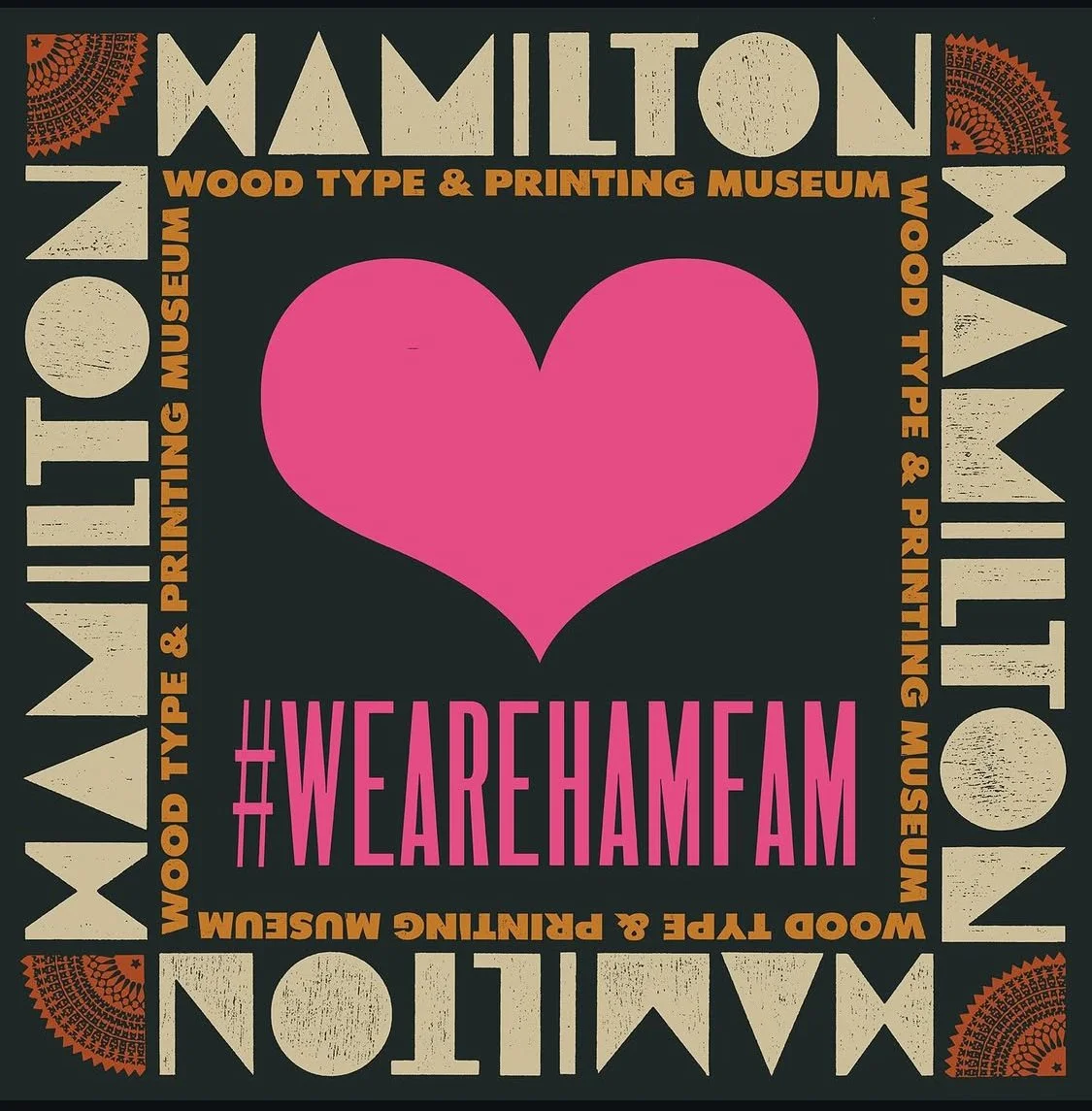 Square graphic promoting the Hamilton Wood Type & Printing Museum #wearehamfam campaign calling for change, with a black background, beige and orange text, a large pink heart in the center, and the hashtag #WEAREHAMFAM below the heart.