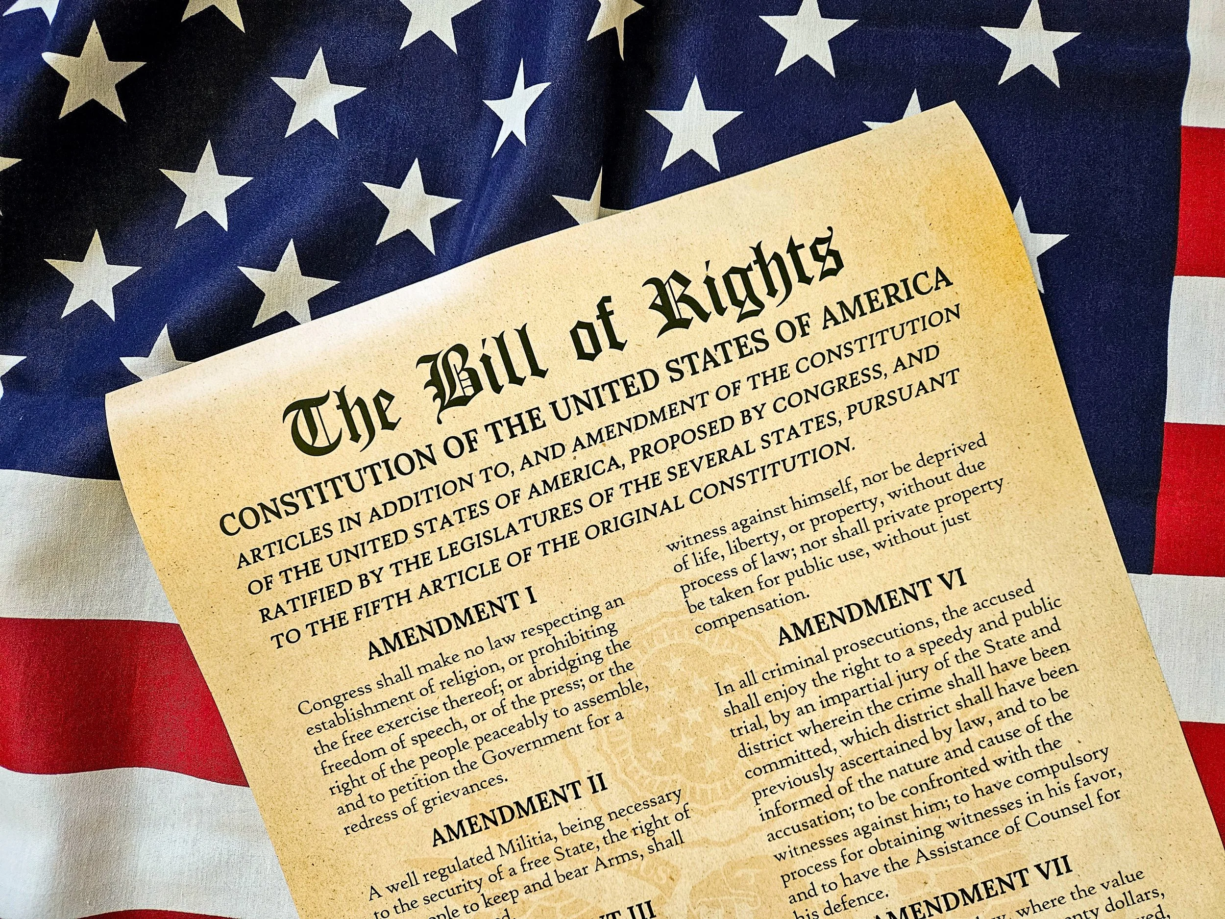 Modern bill of rights on top of flag