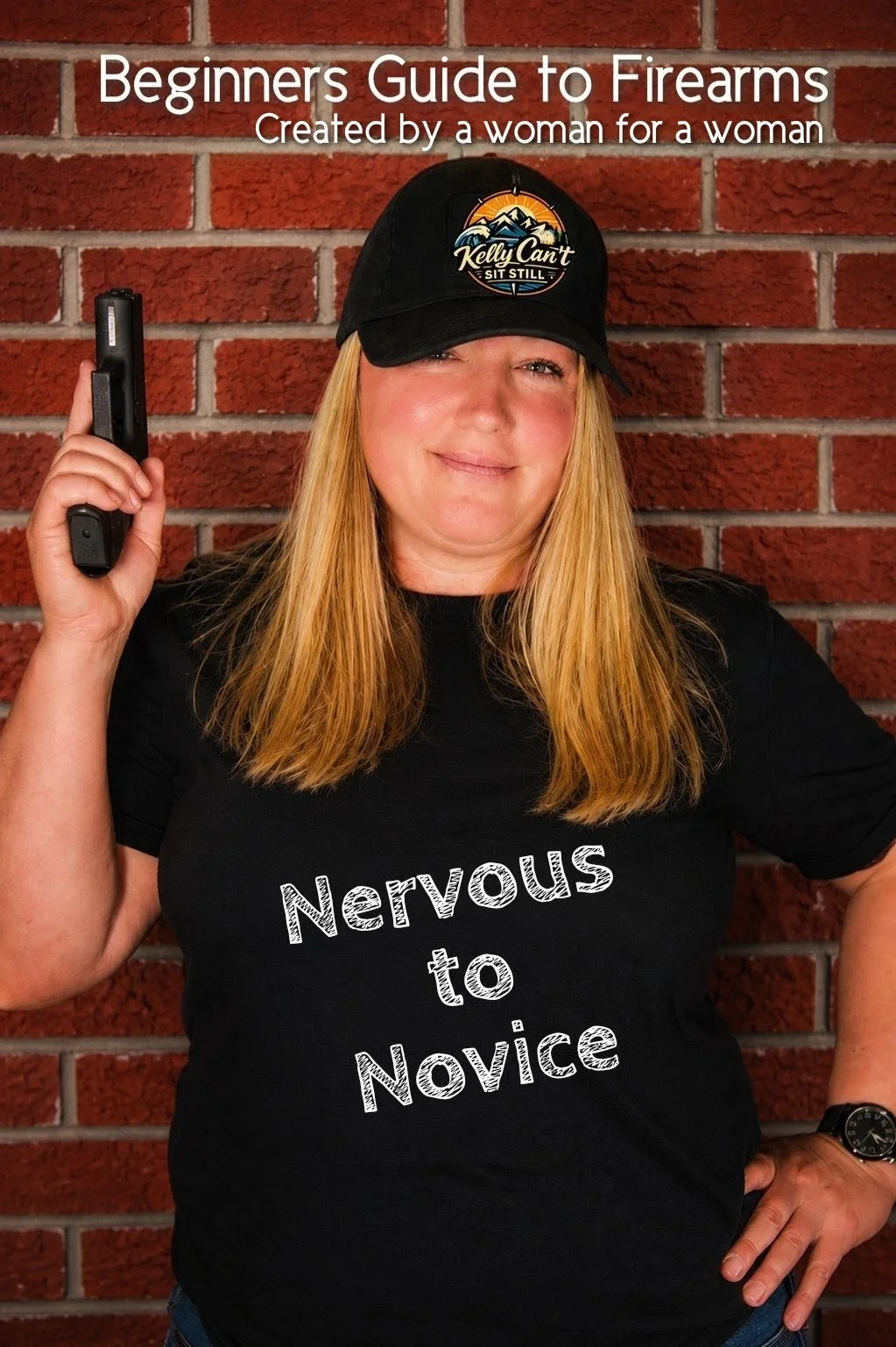 A woman with long blonde hair wearing a black baseball cap and black T-shirt with white text saying "Nervous to Novice". She is holding a handgun in her right hand and standing in front of a red brick wall.