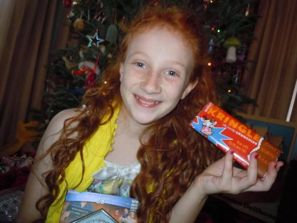 A Nancy Drew fan holding up one of the custom branded Nancy Drew chocolate bars.