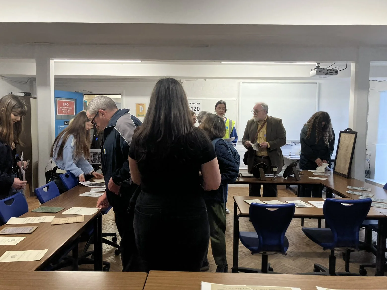 Visitors explore paper artefacts and photos from the grammar school during the Ghost Tour