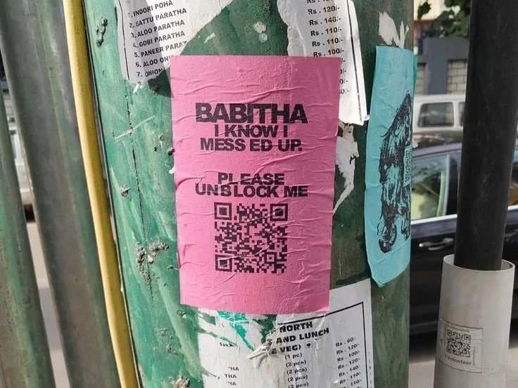 Street-level snipe advertising campaign targeting pedestrians and commuters