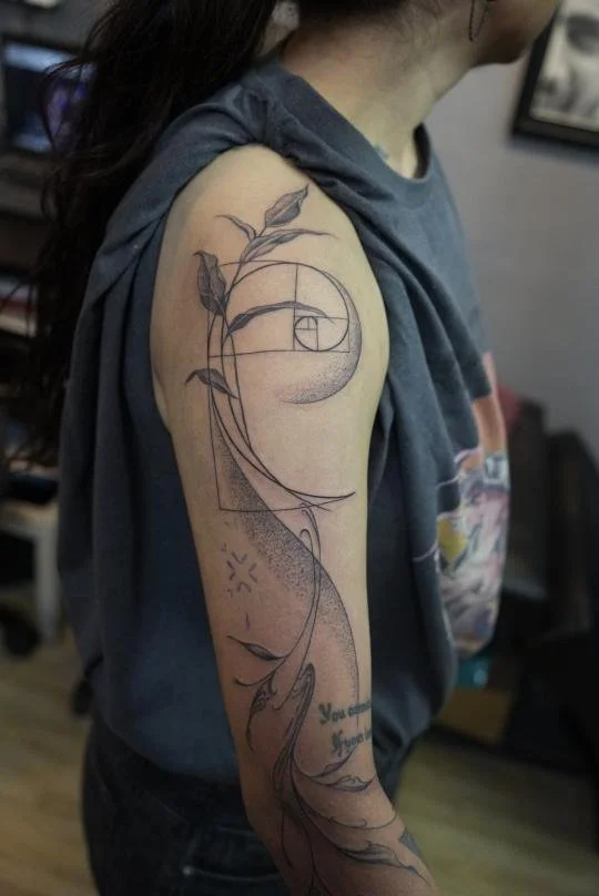 black and gray tattoo on arm, fine lines