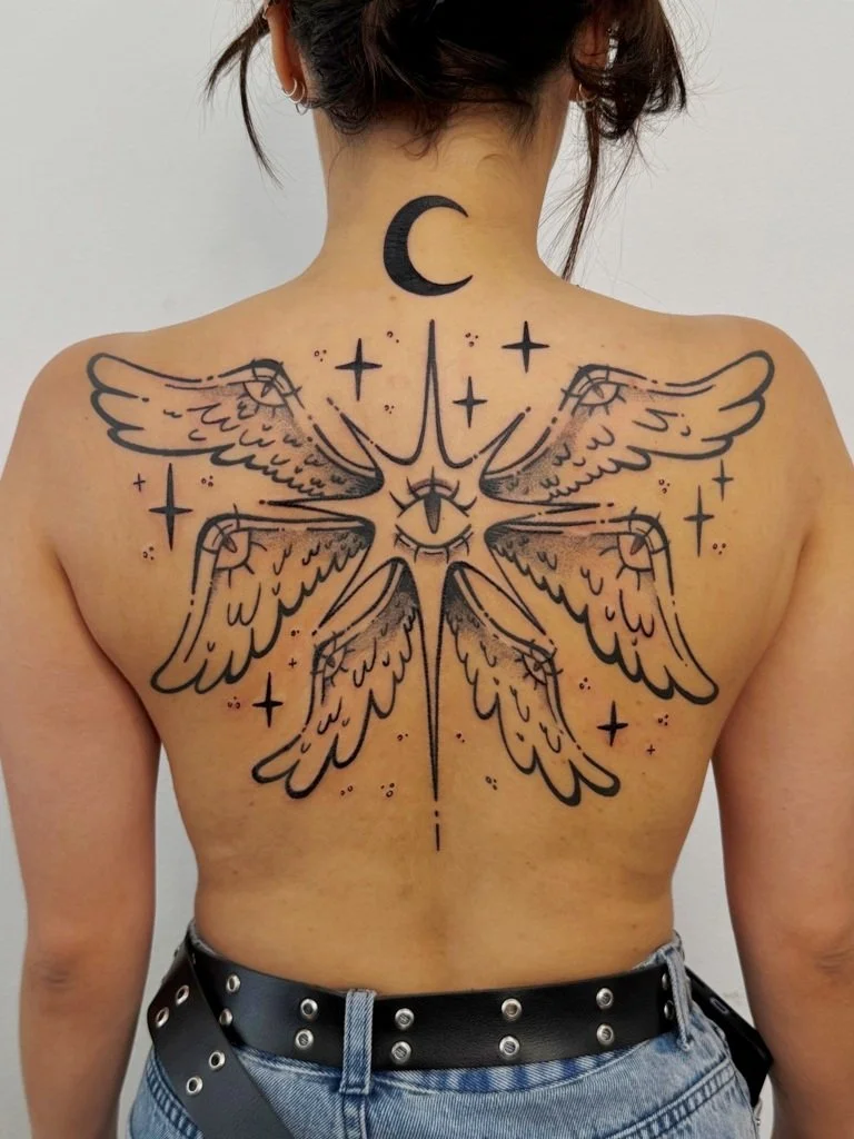 Laura_Arroz_tattoo_artist - star with wings back tattoo