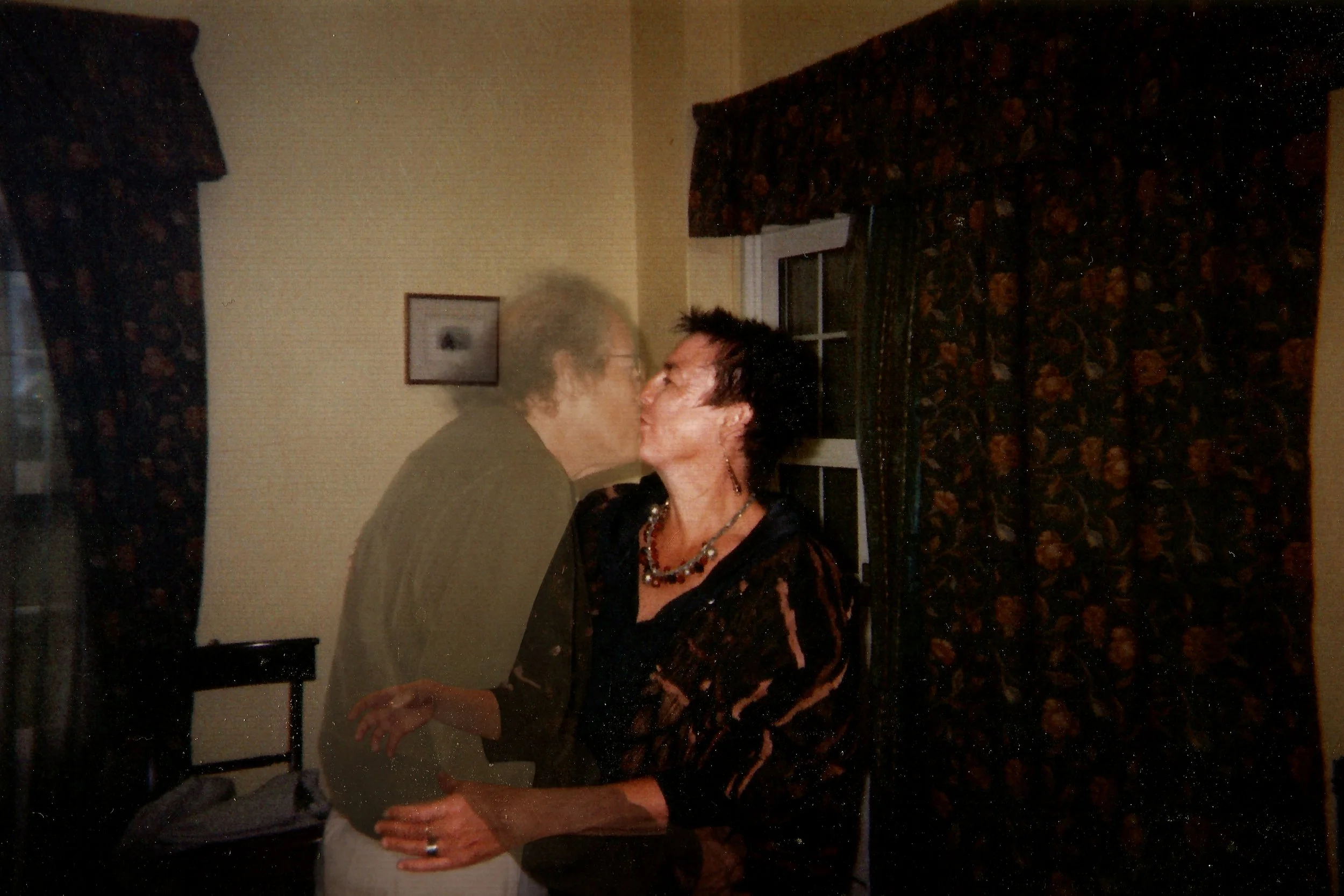 photo by William Josephs Radford - disappearing man kissing wife