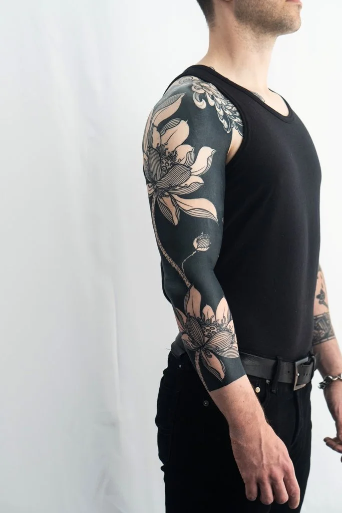 tattoo artist Kevin Ligabue - black and gray Japanese floral inspired sleeve