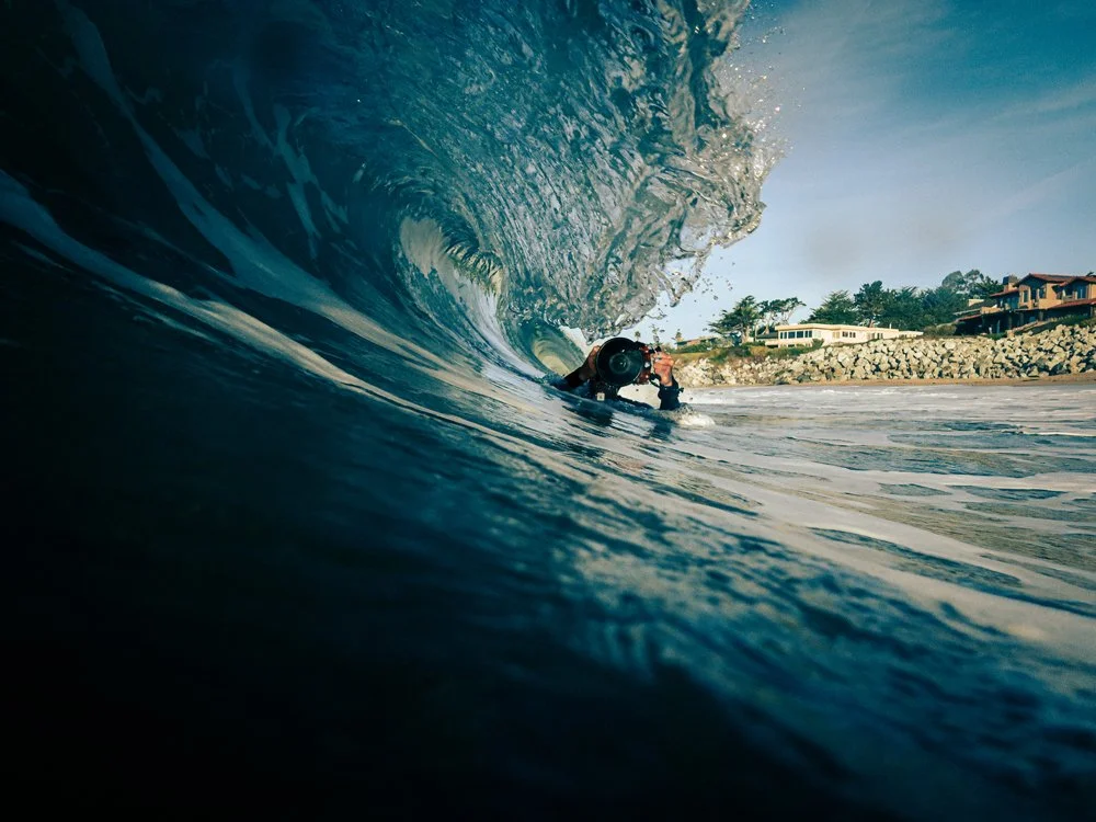 surf photography - holding camera in the waves